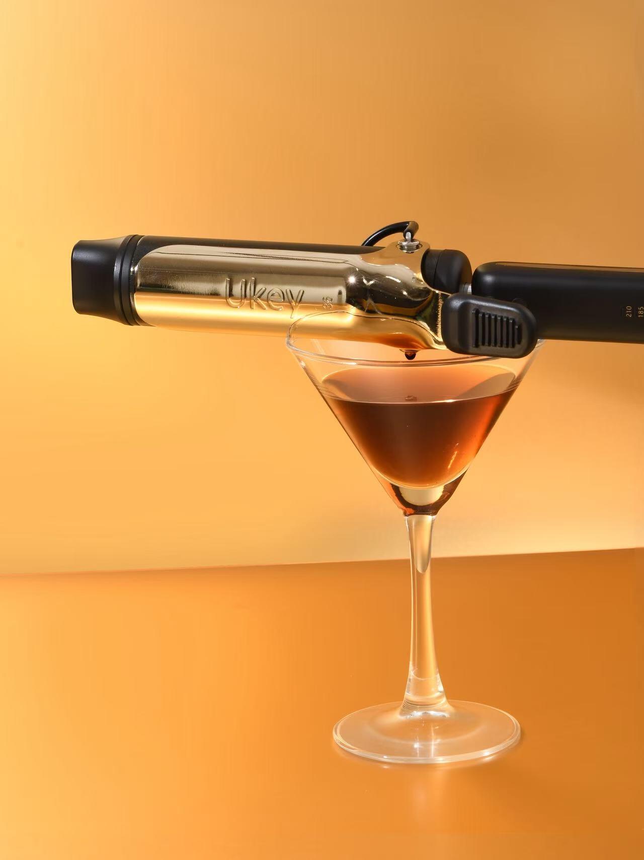 Hair curler creative still life photography with cocktail glass by Lefty Studio