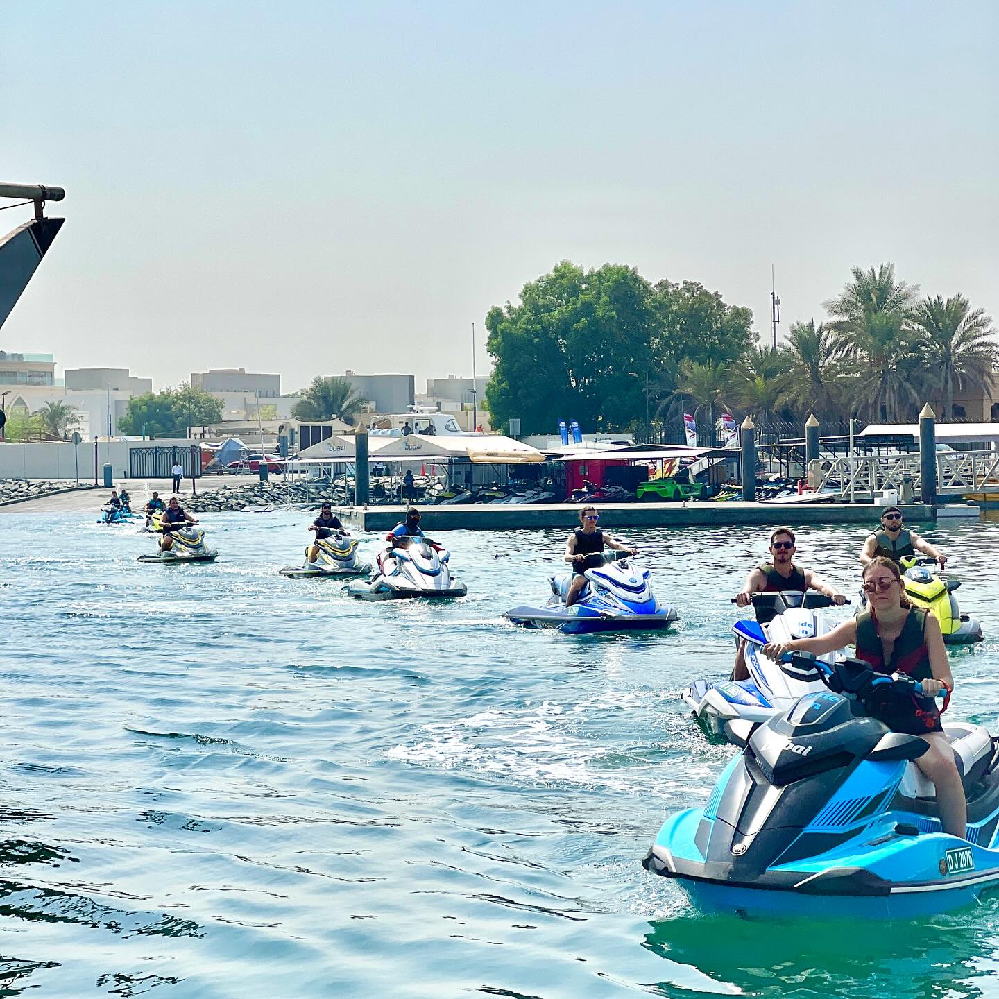 A group of people preparing their jet ski adventure after renting from a jet ski rental.