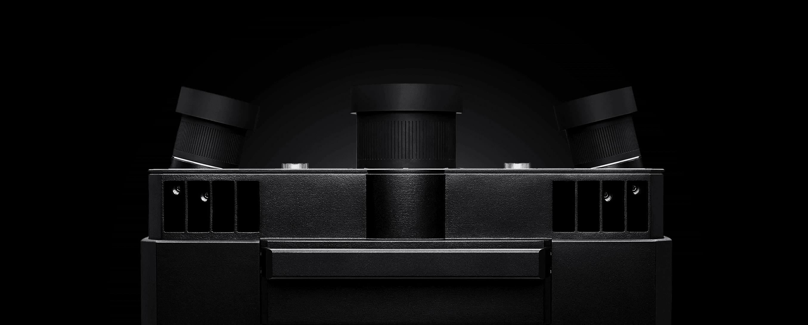 ATOS 5 3D scanner front view with robust industrial housing, shown on a dark background.
