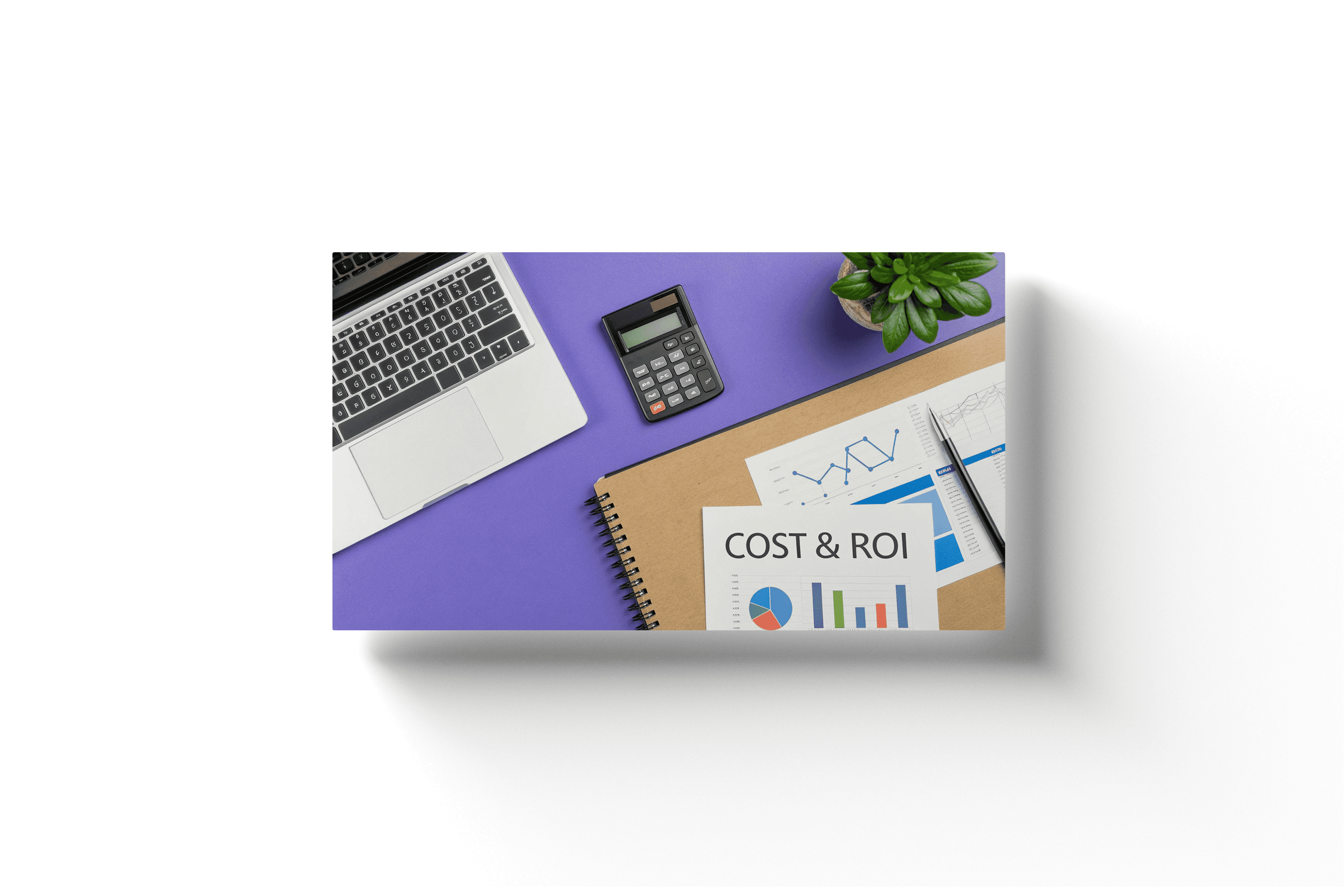 a purple desktop with a few pieces of paper displaying charts, costs, and roi