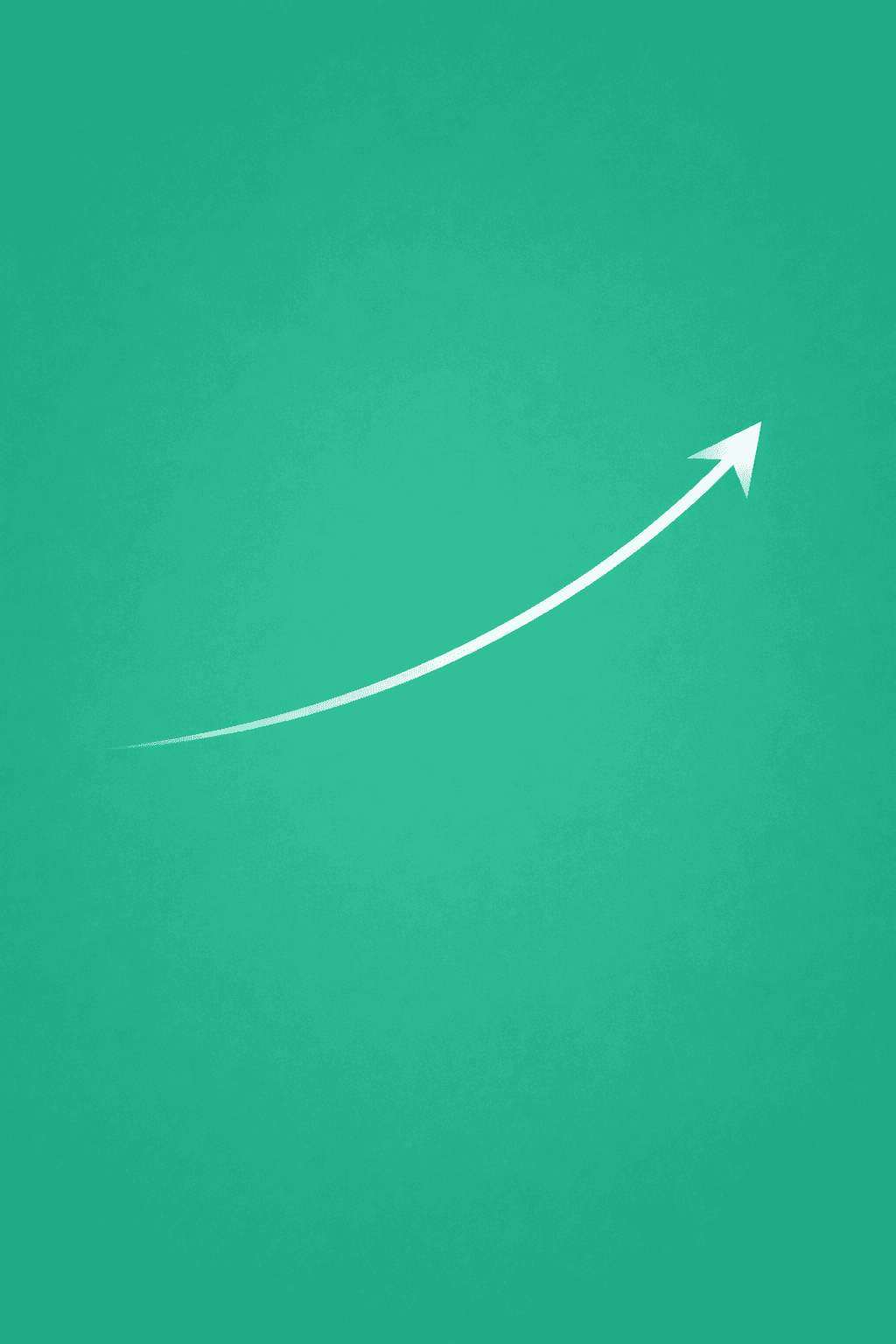 A woman with red hair and a black sleeveless top smiling confidently in a bright, modern indoor setting.