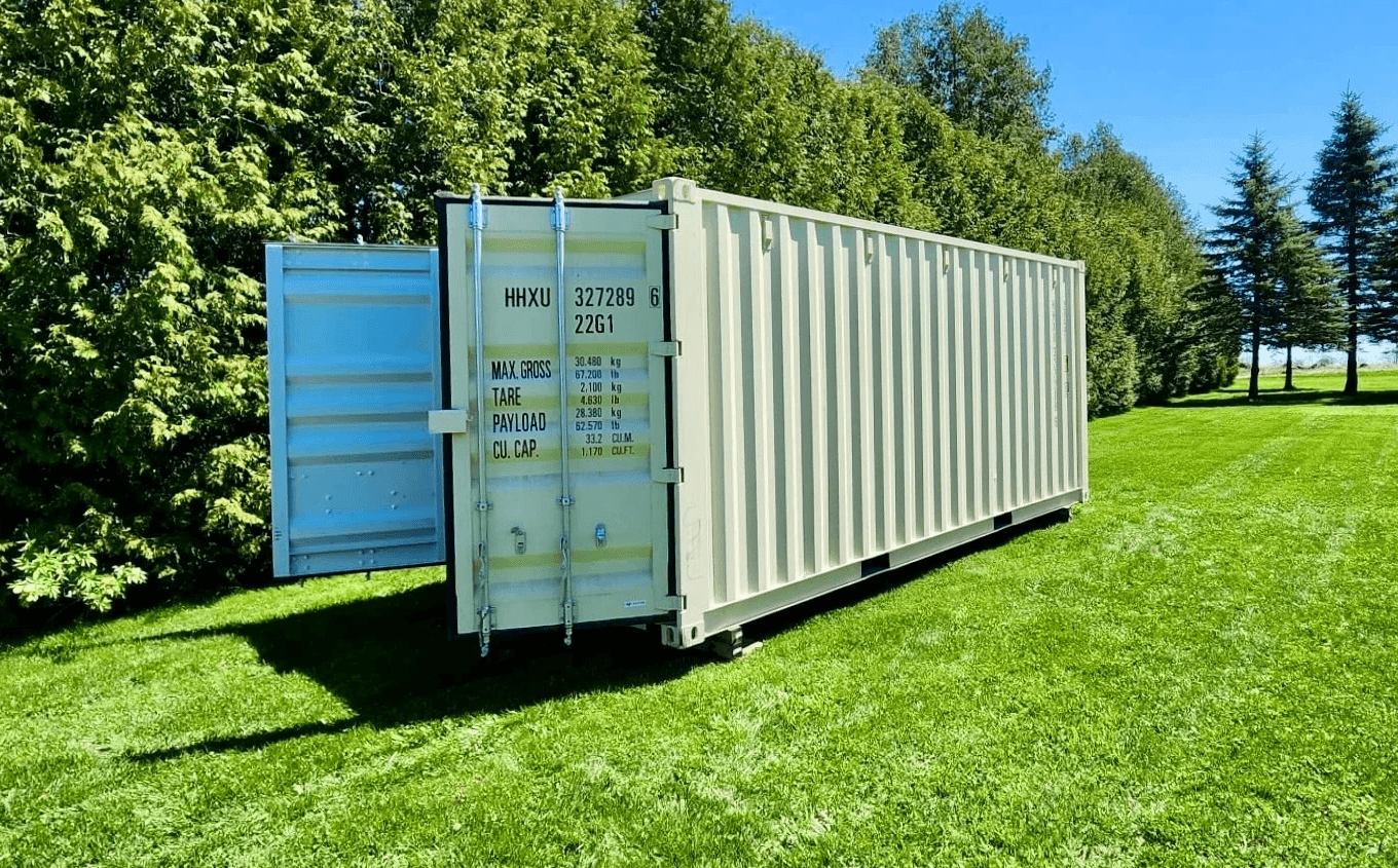 Side view of 20' new double door container on grass