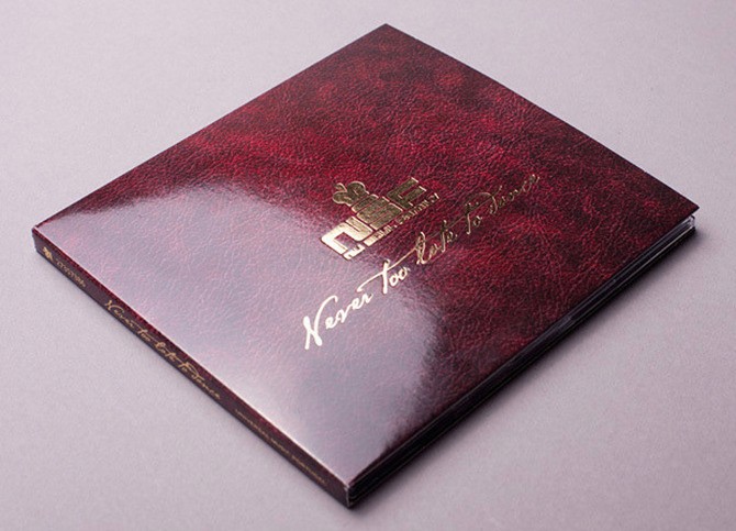 an image of a red and metallic gold digipak packaging with a premium finish