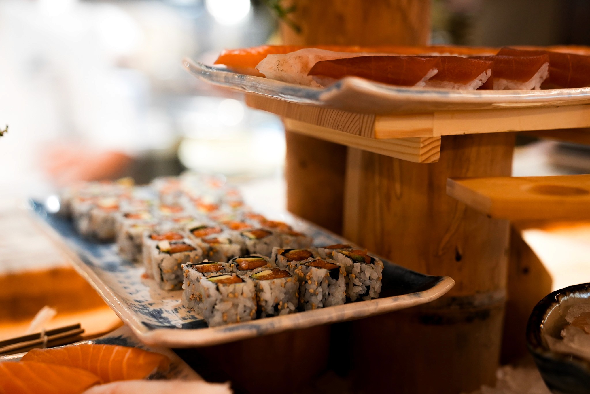 Bride in white dress walking on street, man in background