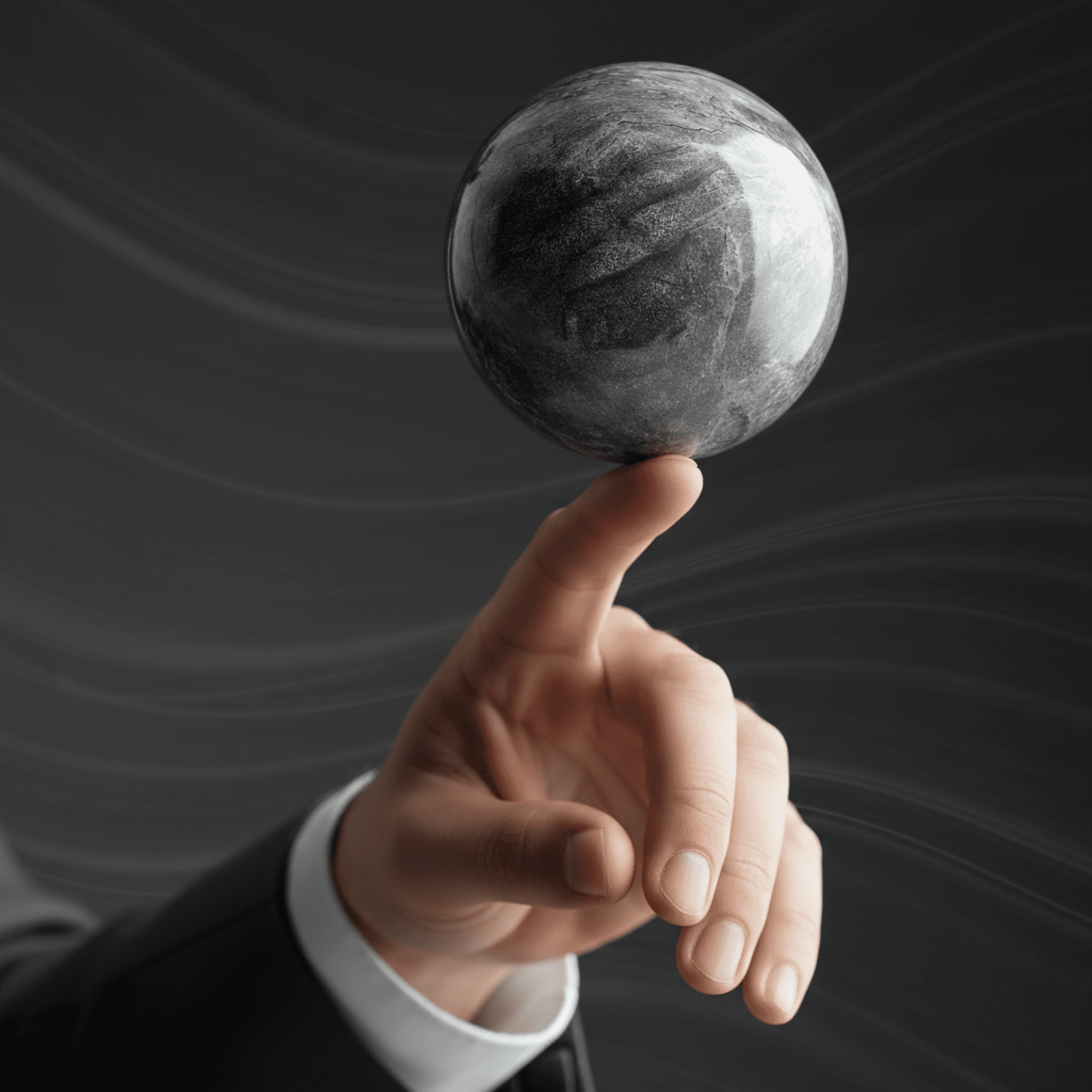 Black and white image of people working at a table with laptops, showing hands gesturing during discussion of digital content displayed on screens, with fabrica® logo in the corner.