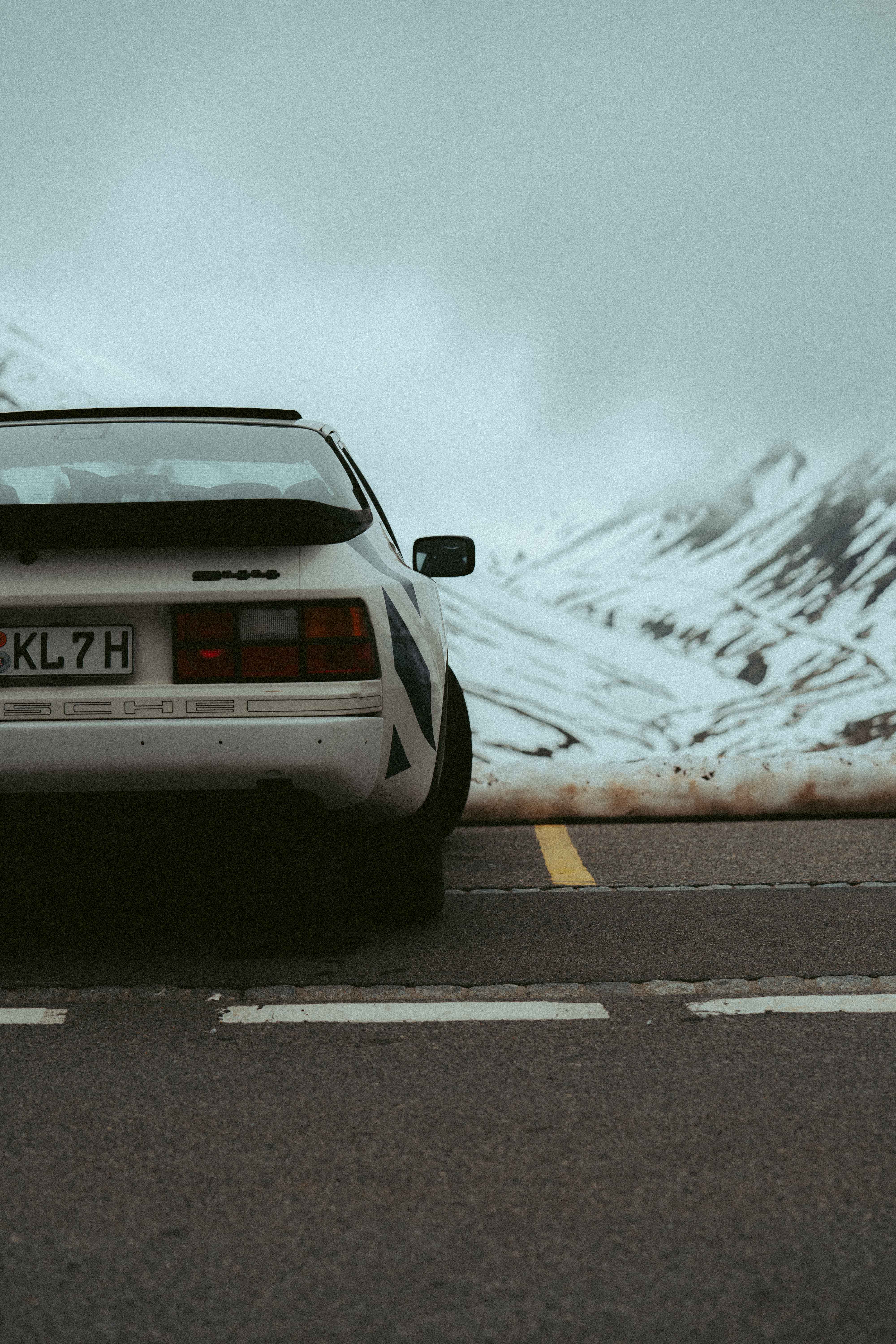 Desert footsteps leading through soft dunes under pale morning light in AlUla.