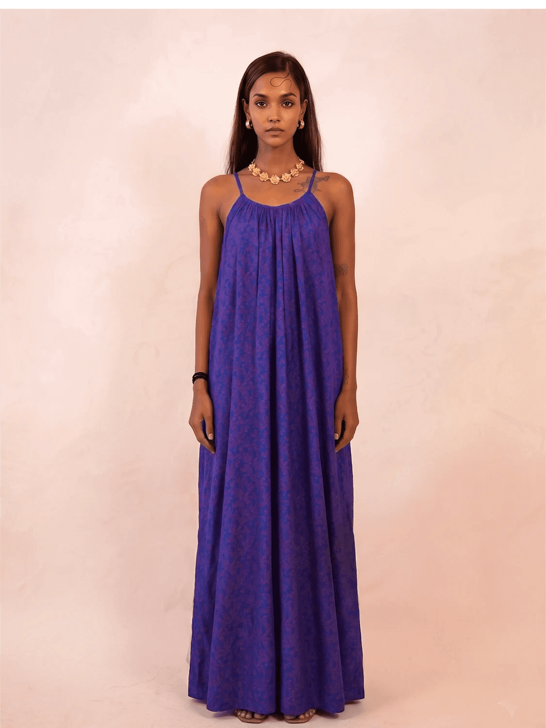 ZOYA is a one-of-a-kind slip dress handcrafted from a vintage silk saree, reimagined into something light, fluid, and enduring.
