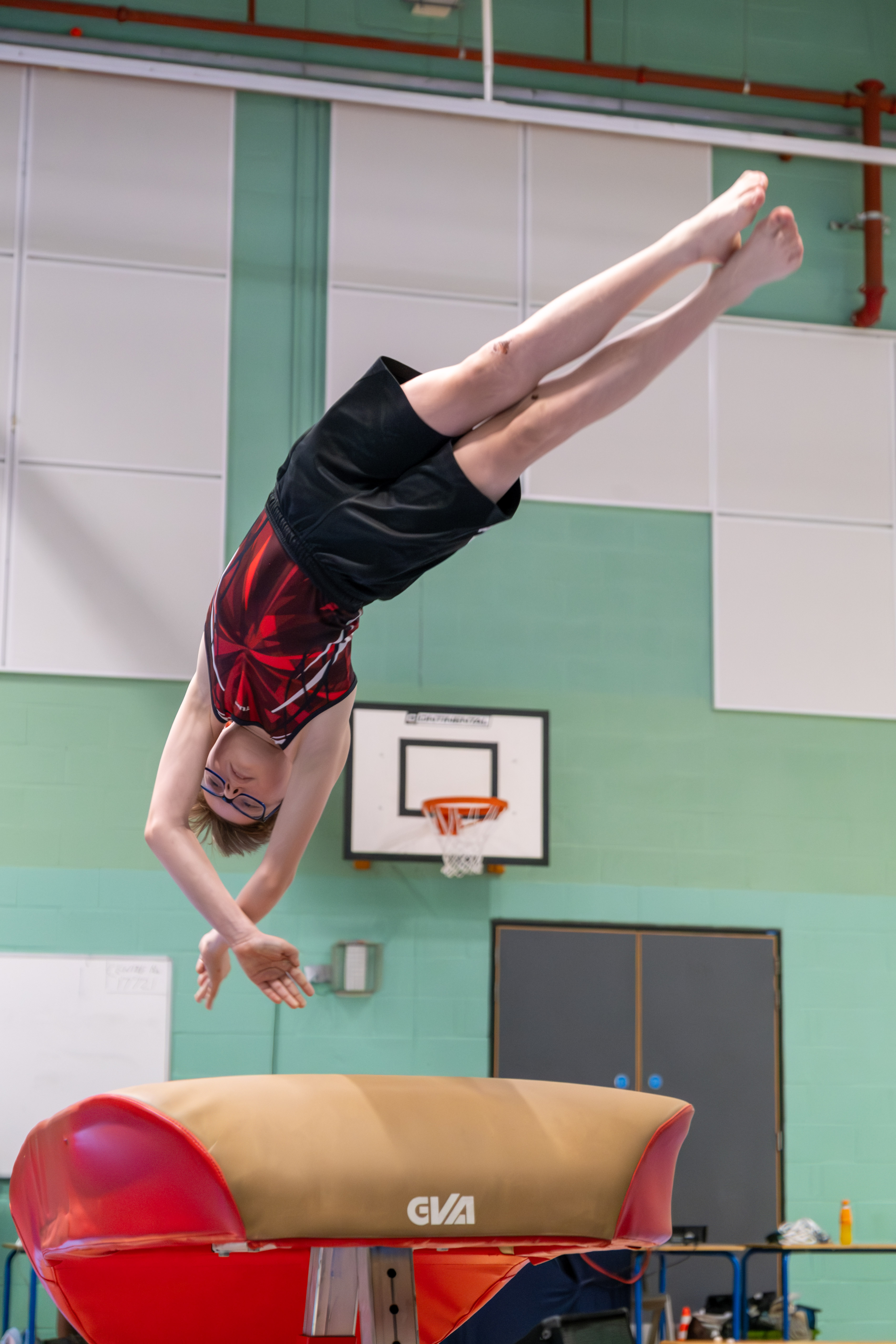 Gymnast practising a supported vault skill at Swan Academy