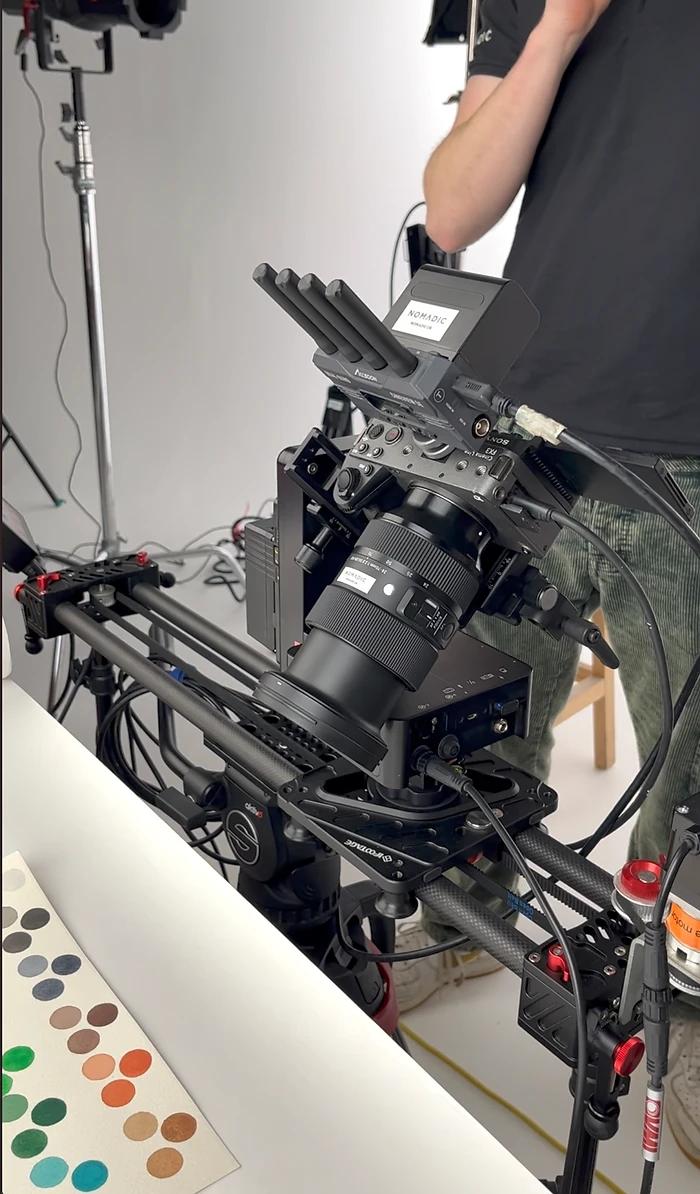 A dolly cam or slider on a video production shoot in action