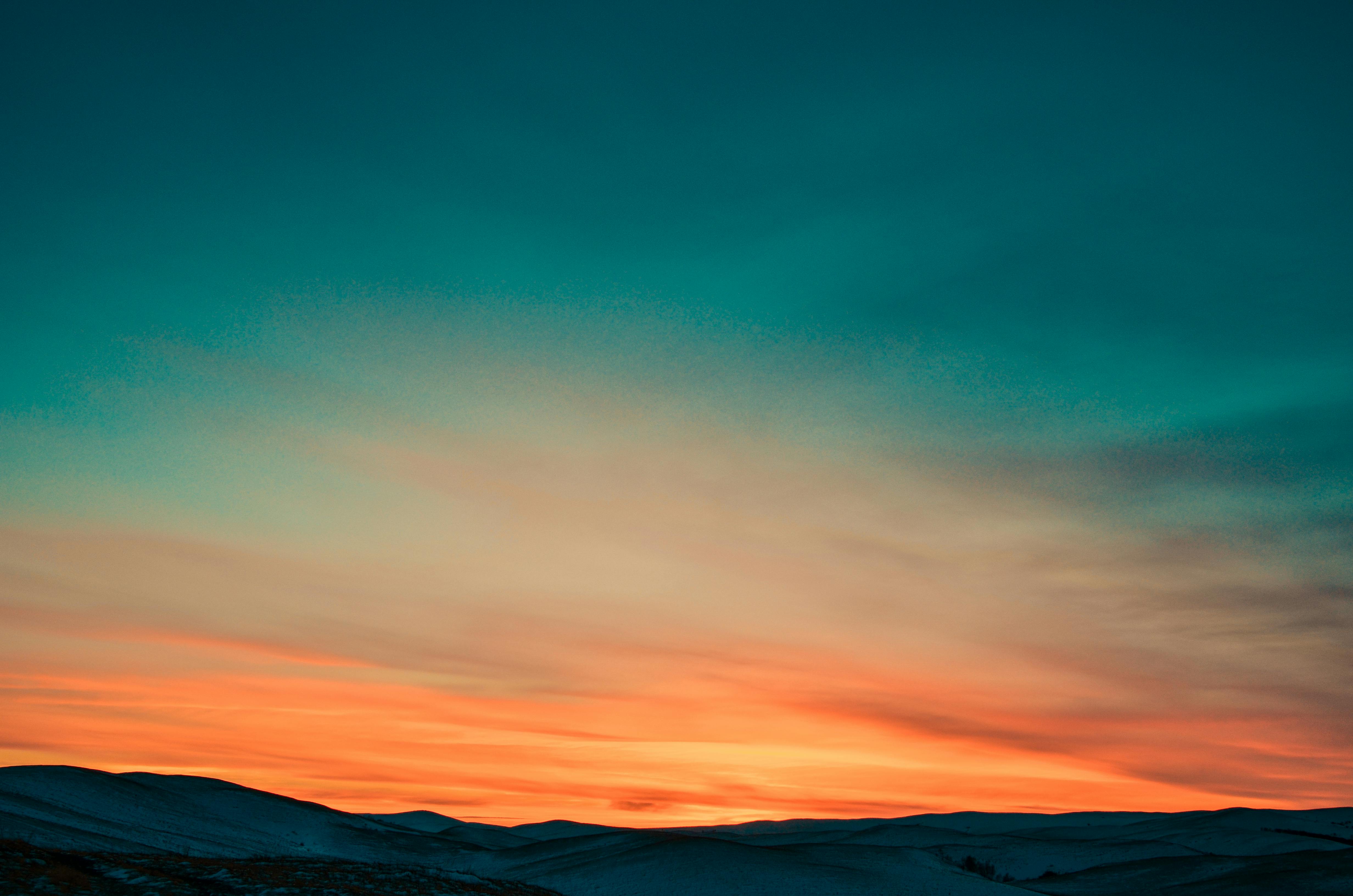 Photo by NO  NAME: https://www.pexels.com/photo/sunset-over-snow-covered-mountains-66997/