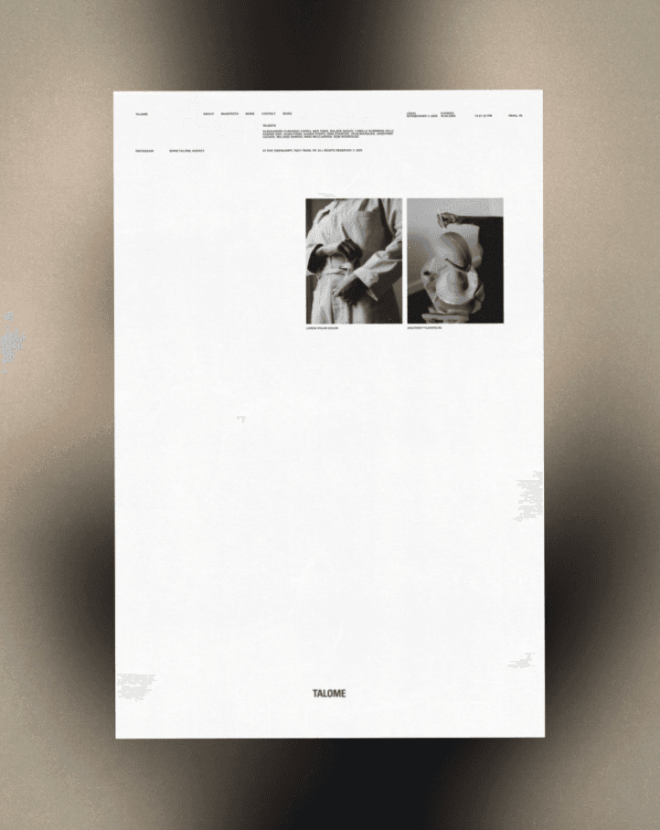 A smiling woman with her arms crossed, standing against a dark green background. She has long, dark hair.