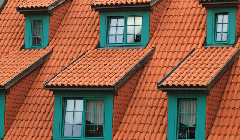 Red roof with a green windows