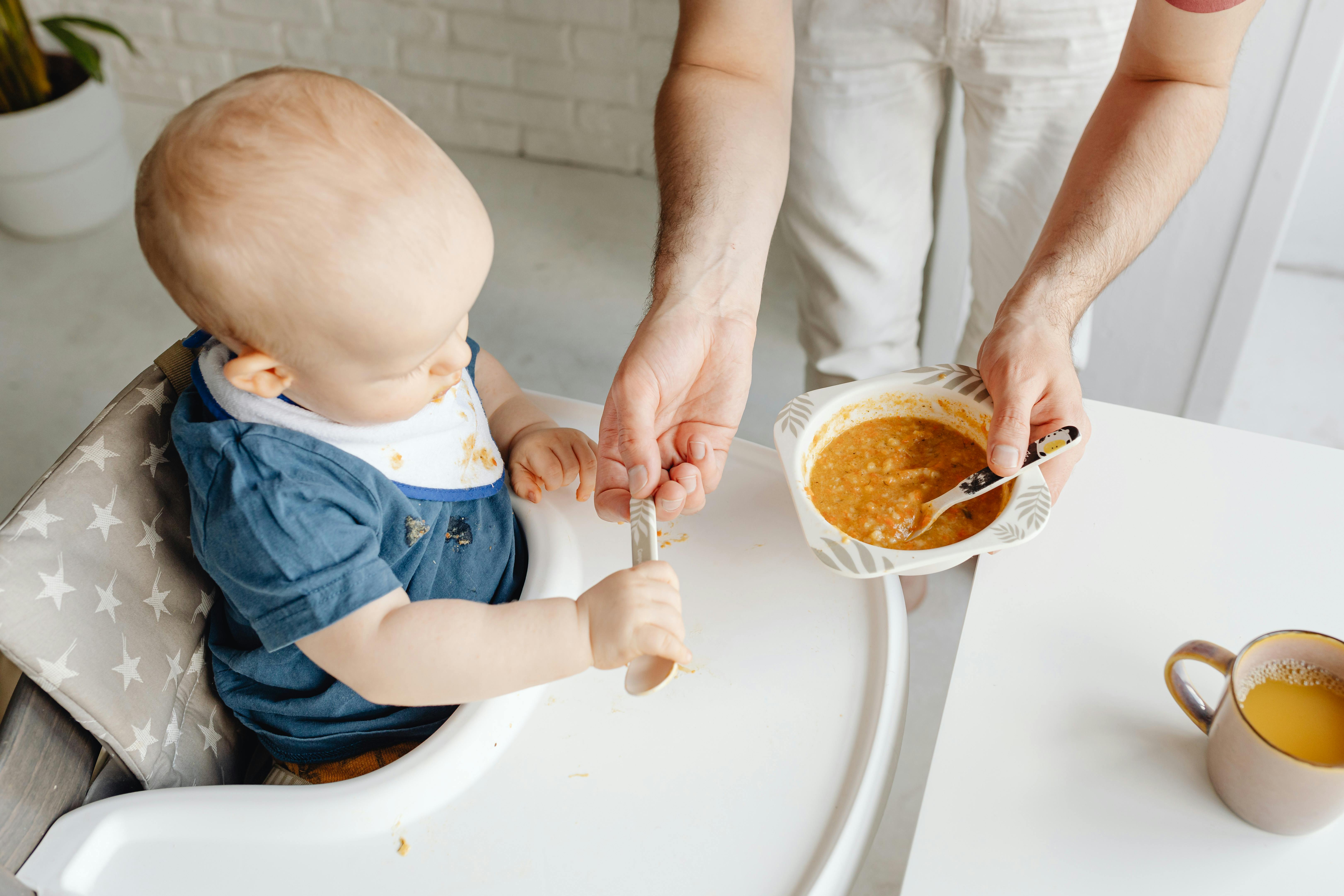 Baby weaning. Parent learning how to wean their baby 