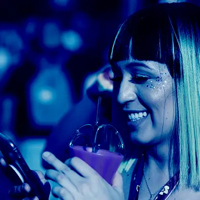 woman at party on mobile phone