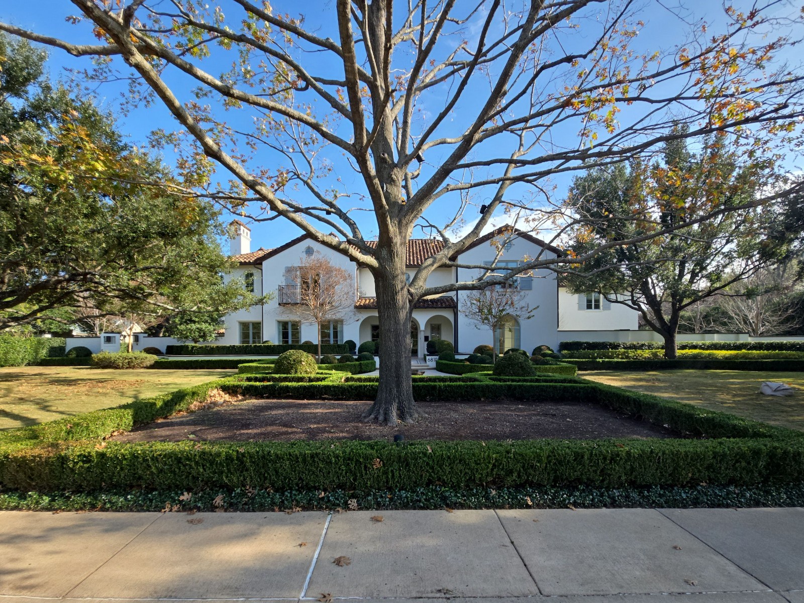 Backyard drainage installation in a Dallas yard with French drain trench and graded base