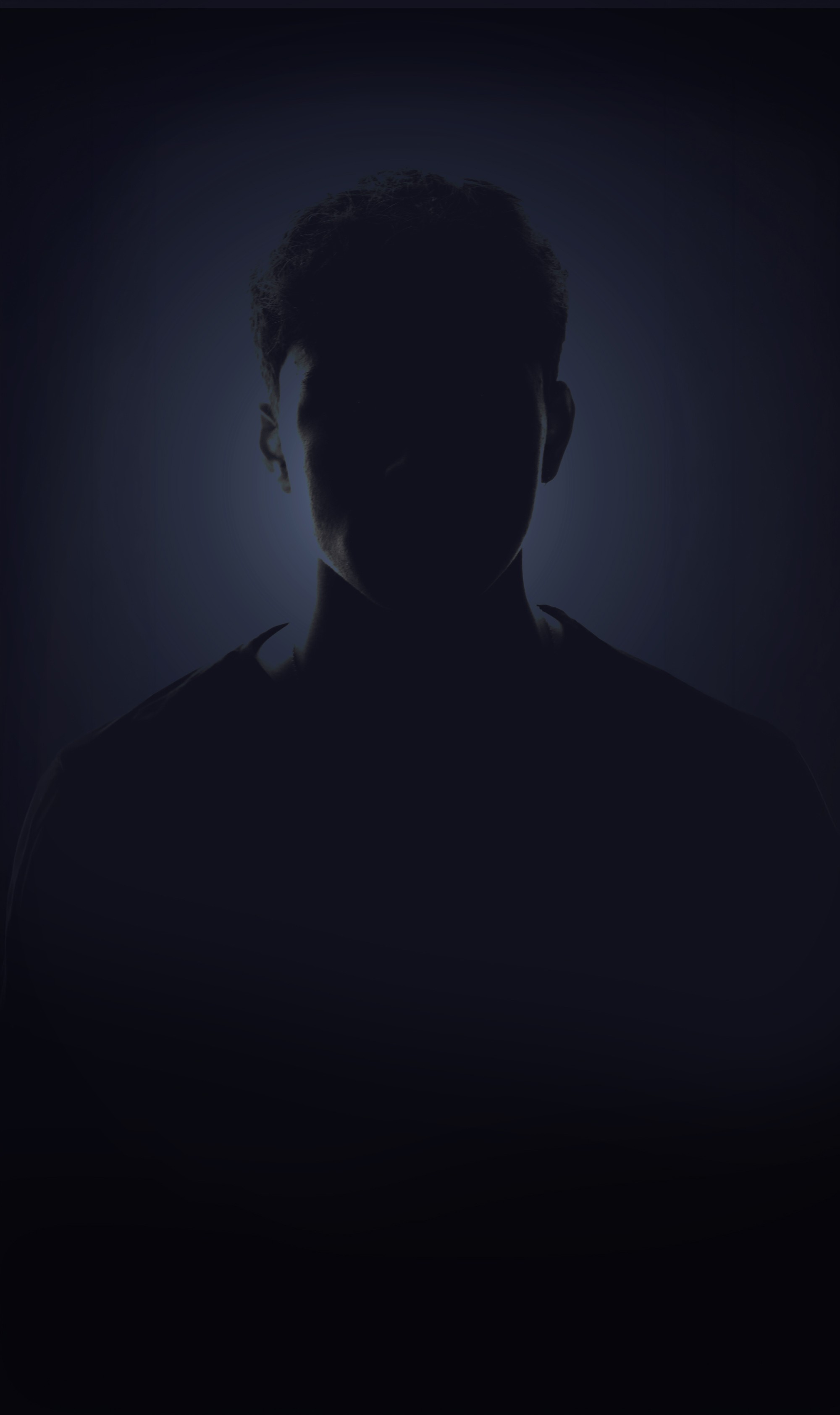 A silhouette of a man in the dark