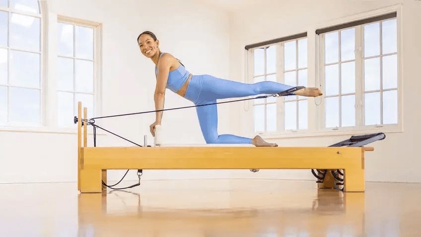 Pilates Reformer Leg Exercises - press heels high on