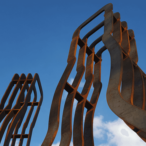 Large-scale outdoor public artwork sculptural whisky installation made from corten steel