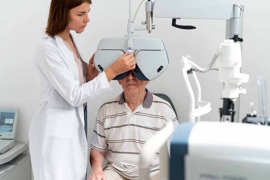 An old man having his eyes checked.