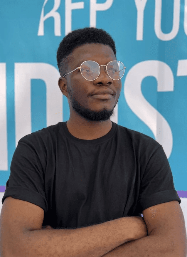Profile portrait of a man in a grey shirt