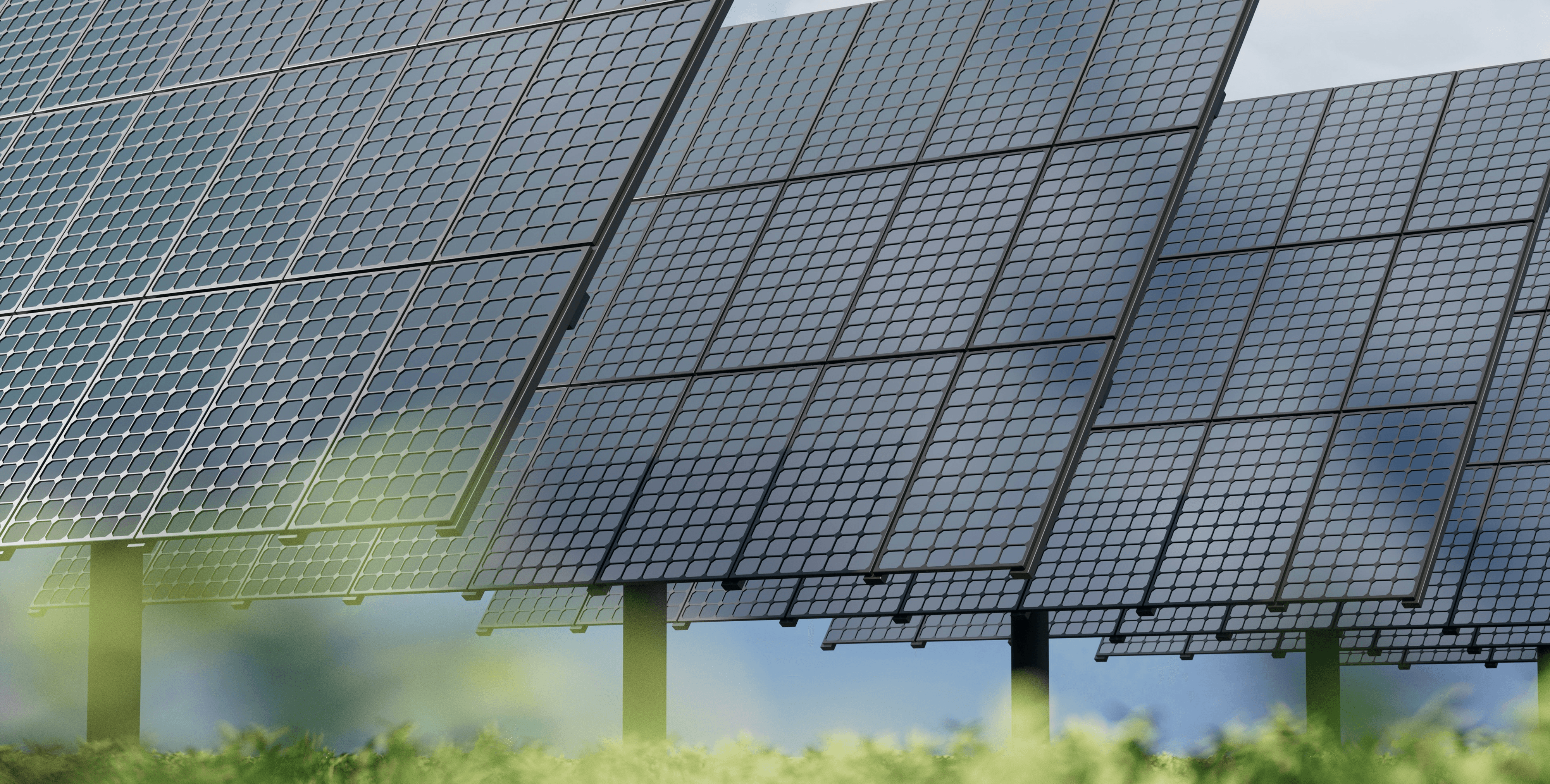 Expansive solar fields stretching over gentle hills under a clear, bright sky
