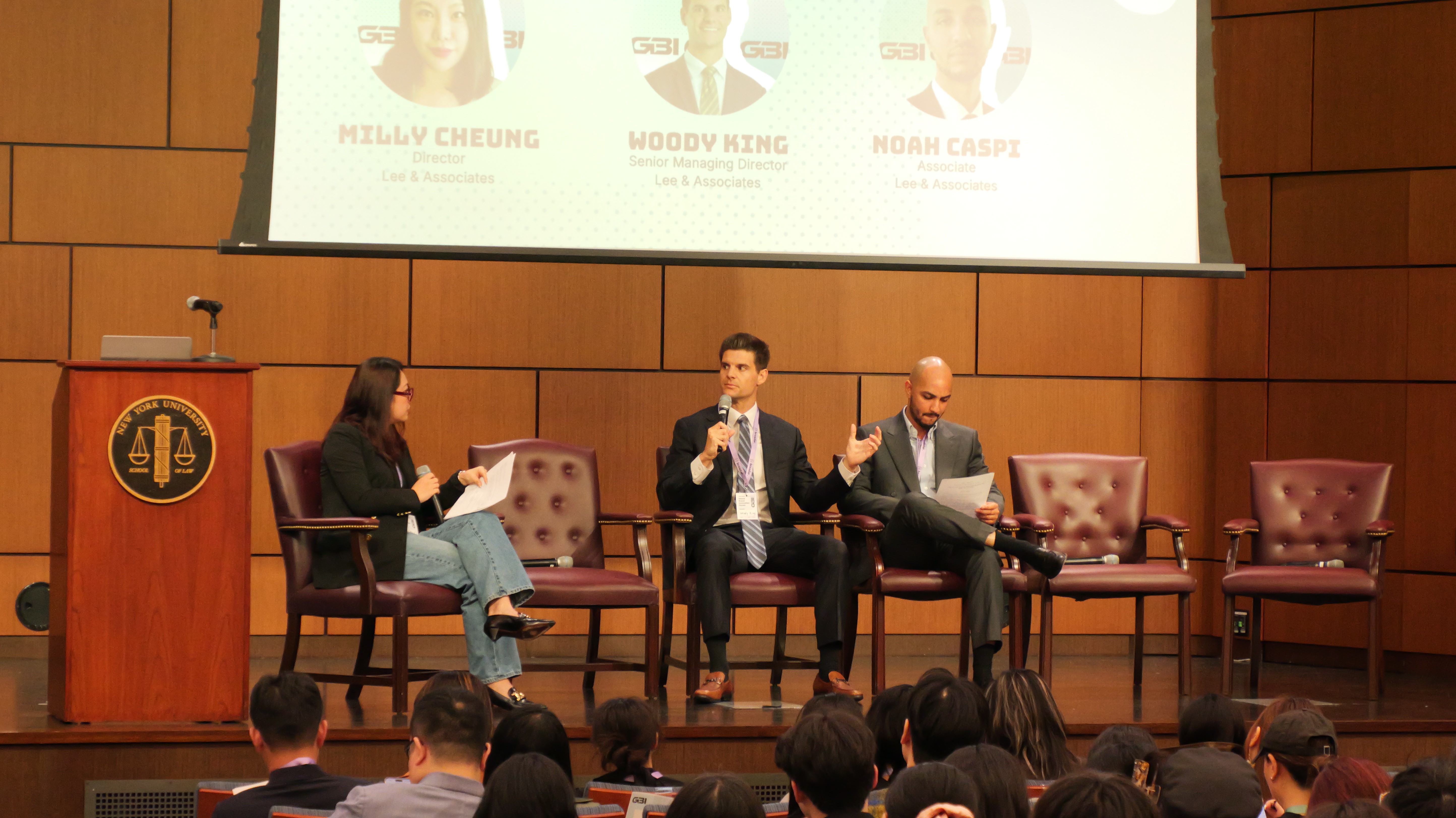 a group of children sitting on steps in front of a building