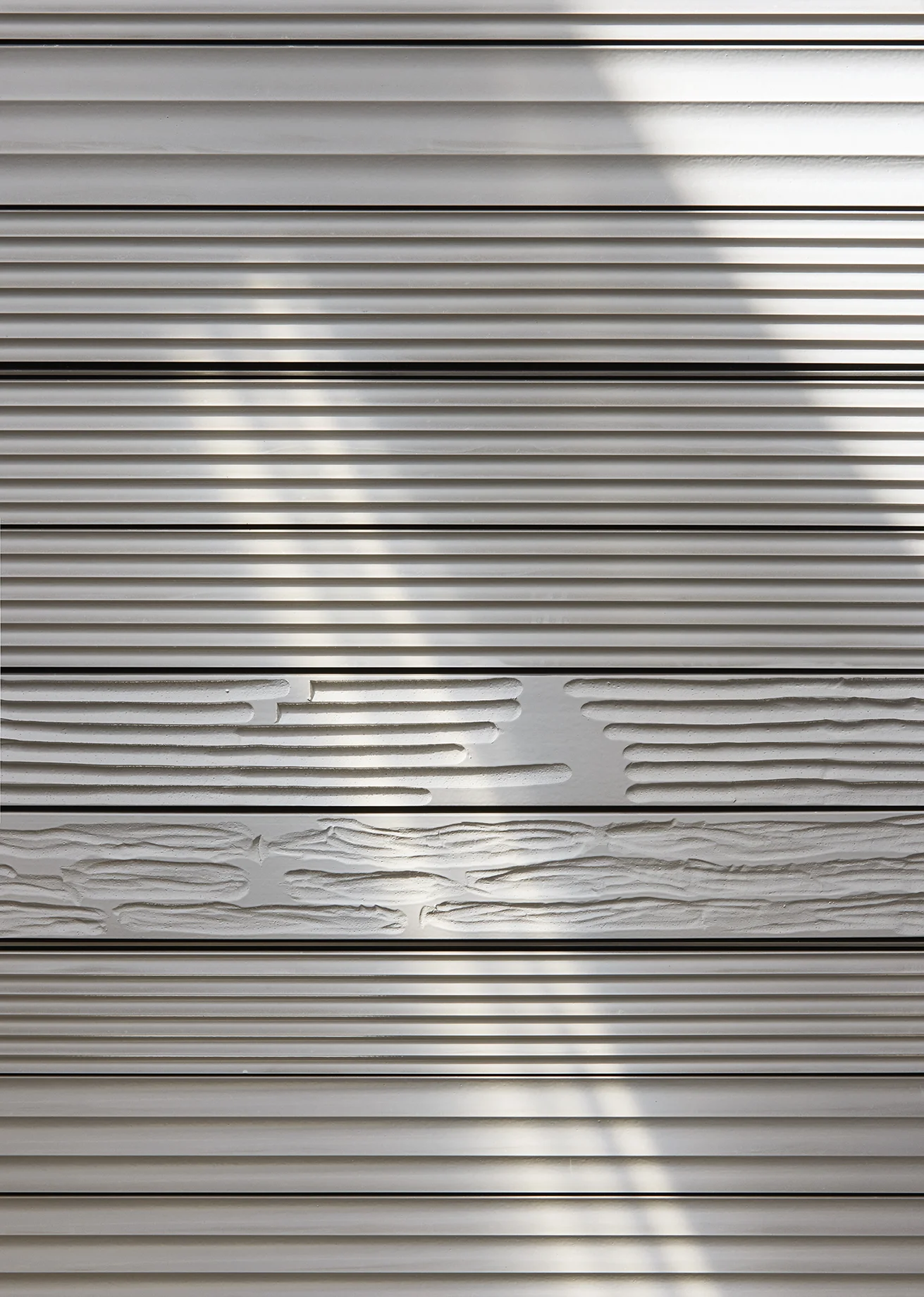 Installation photograph of the public commission work installed at Enghave Brygge Metro, Copenhagen. Ceramic wall panels with handcrafted relief.