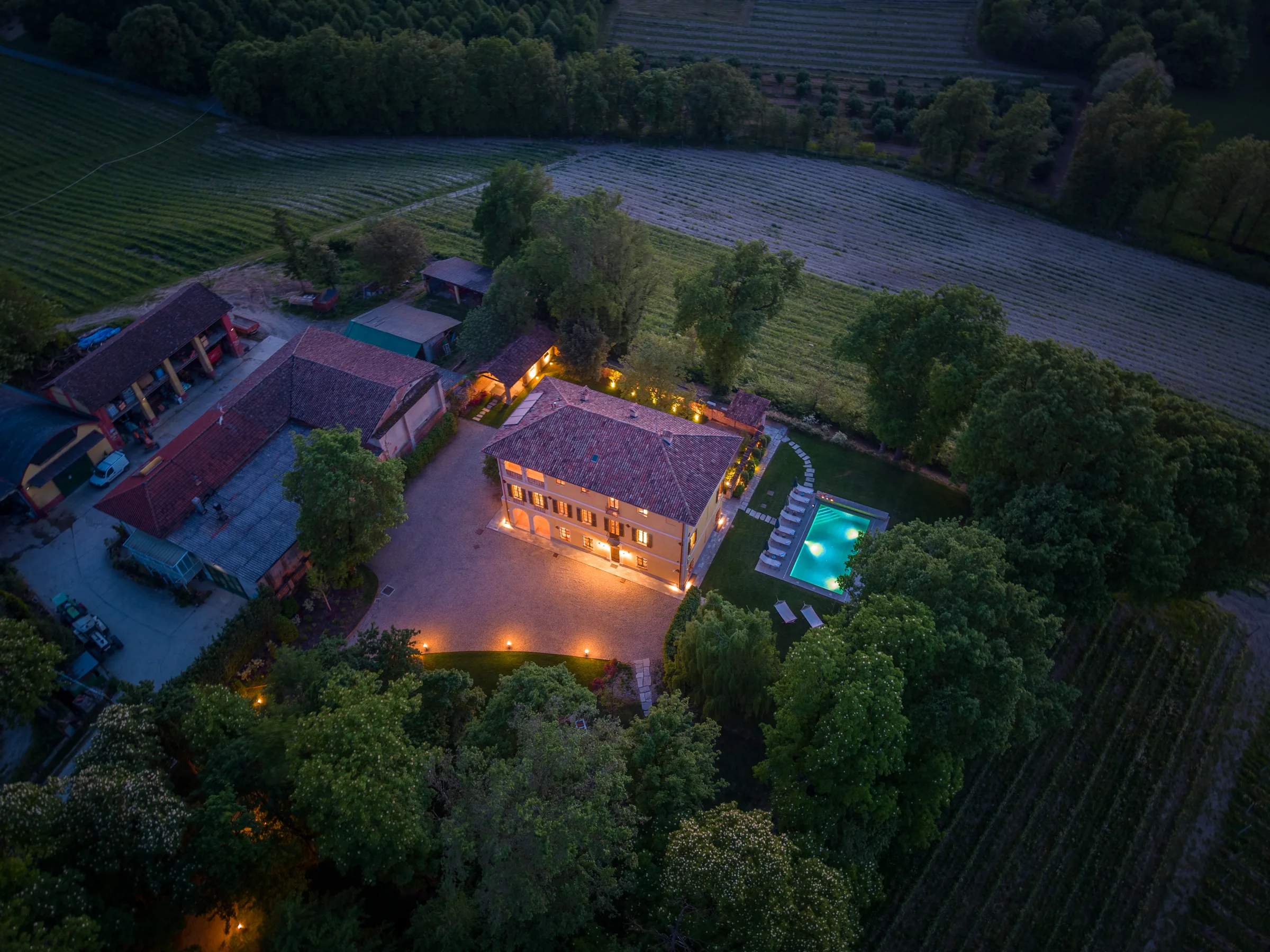 Aerial view of the property at dusk — Nizza Monferrato, Italy. Photography by Yunes Calore.