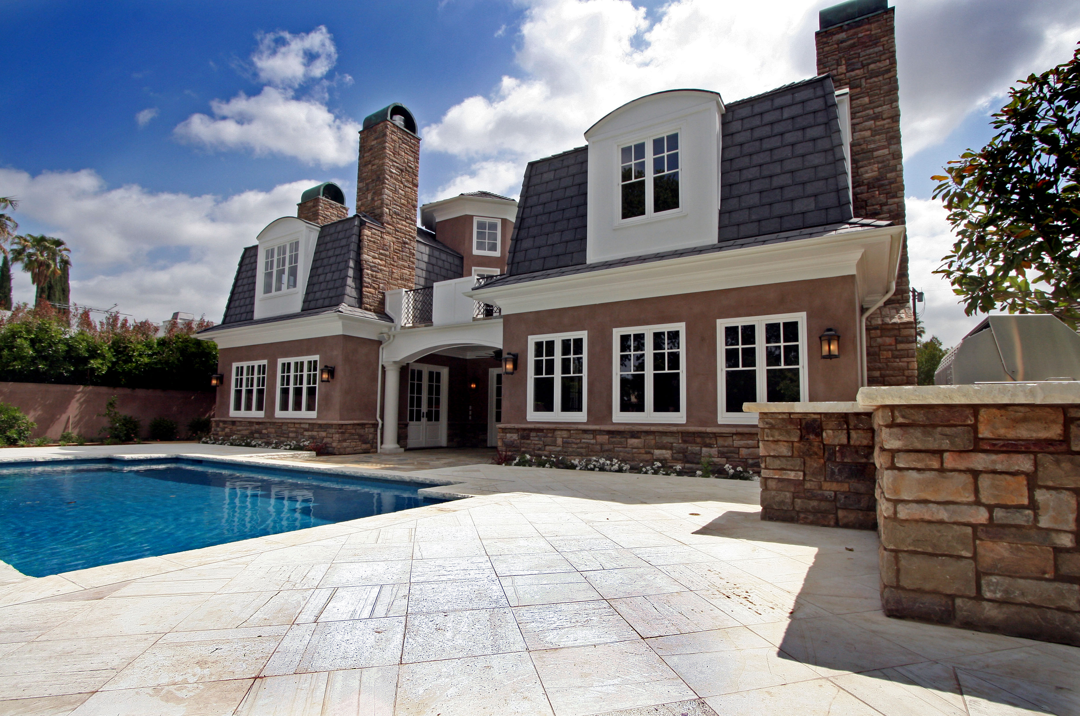 Close-up of the backyard with a pool, emphasizing the serene and luxurious outdoor space.