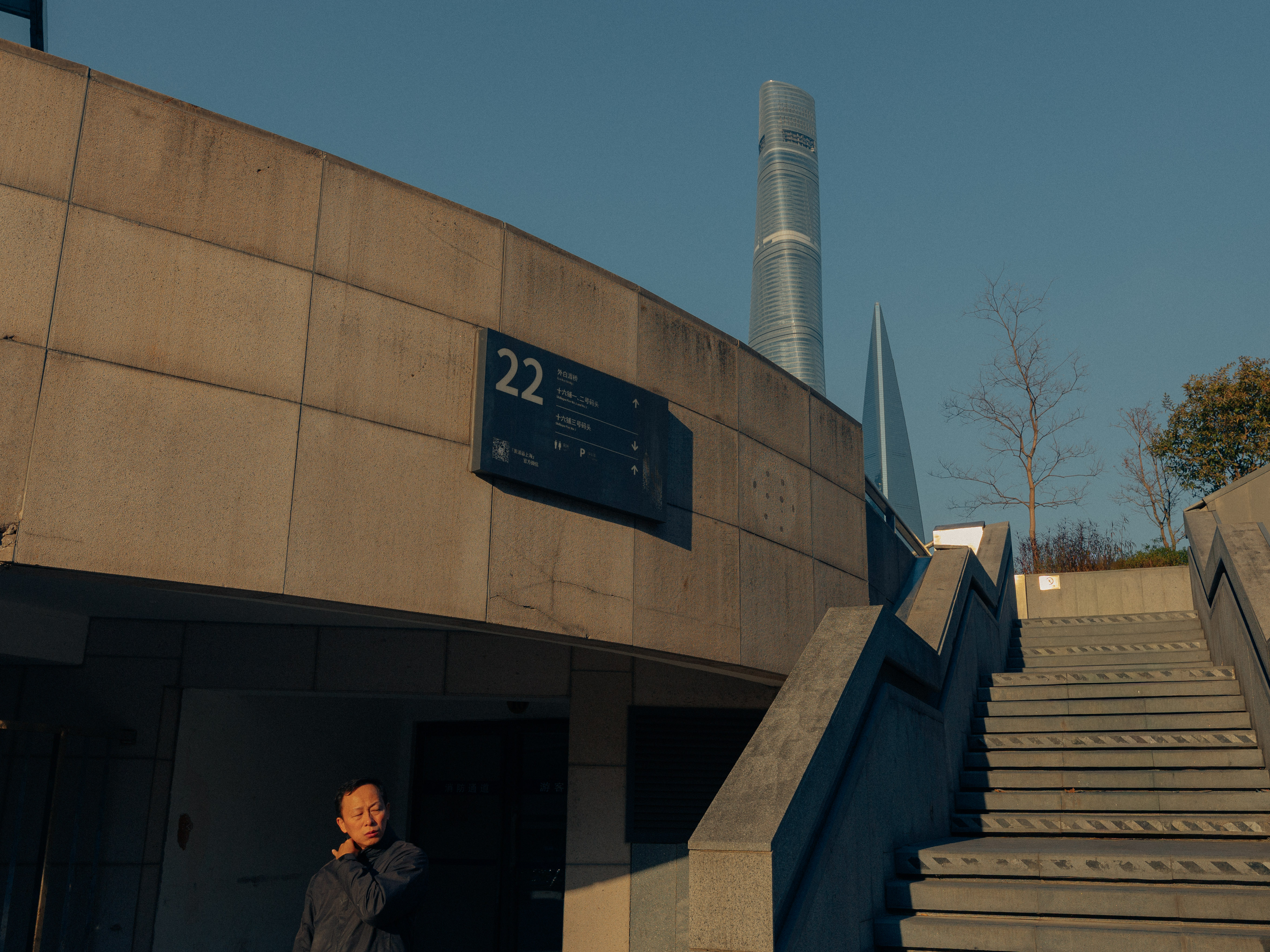 Male sailor from the ACS Independent team focused on steering his boat during the A Division race action.