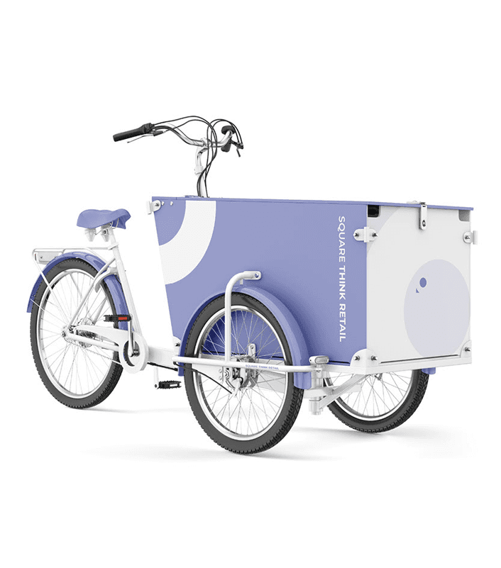 Cargo bike wrapped in Square Think Retail branding with periwinkle and white geometric graphics.