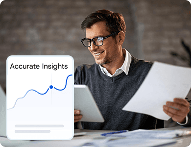 Smiling professional reviewing documents with a floating “Accurate Insights” chart overlay, representing reliable AI-driven analytics.