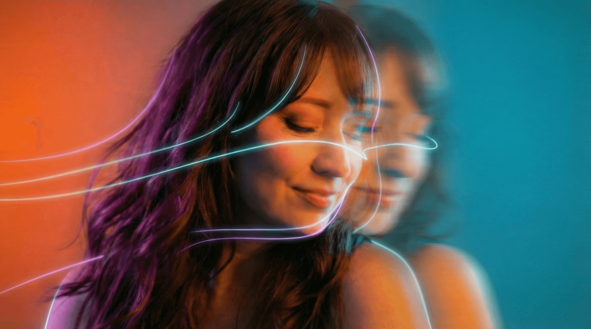 Artistic portrait with red and blue lighting creating a dramatic effect