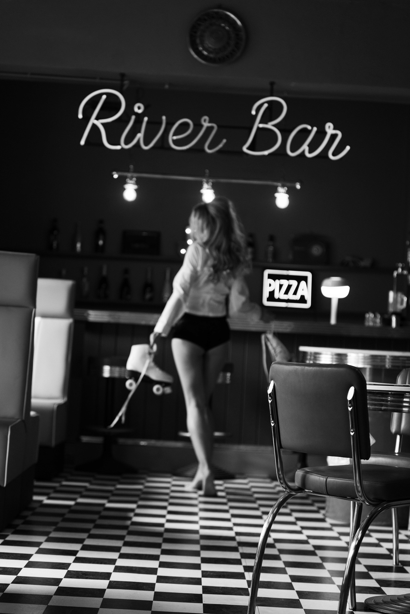 Agnieszka Czyzkowska fine art photography Warsaw woman from behind American diner black and white