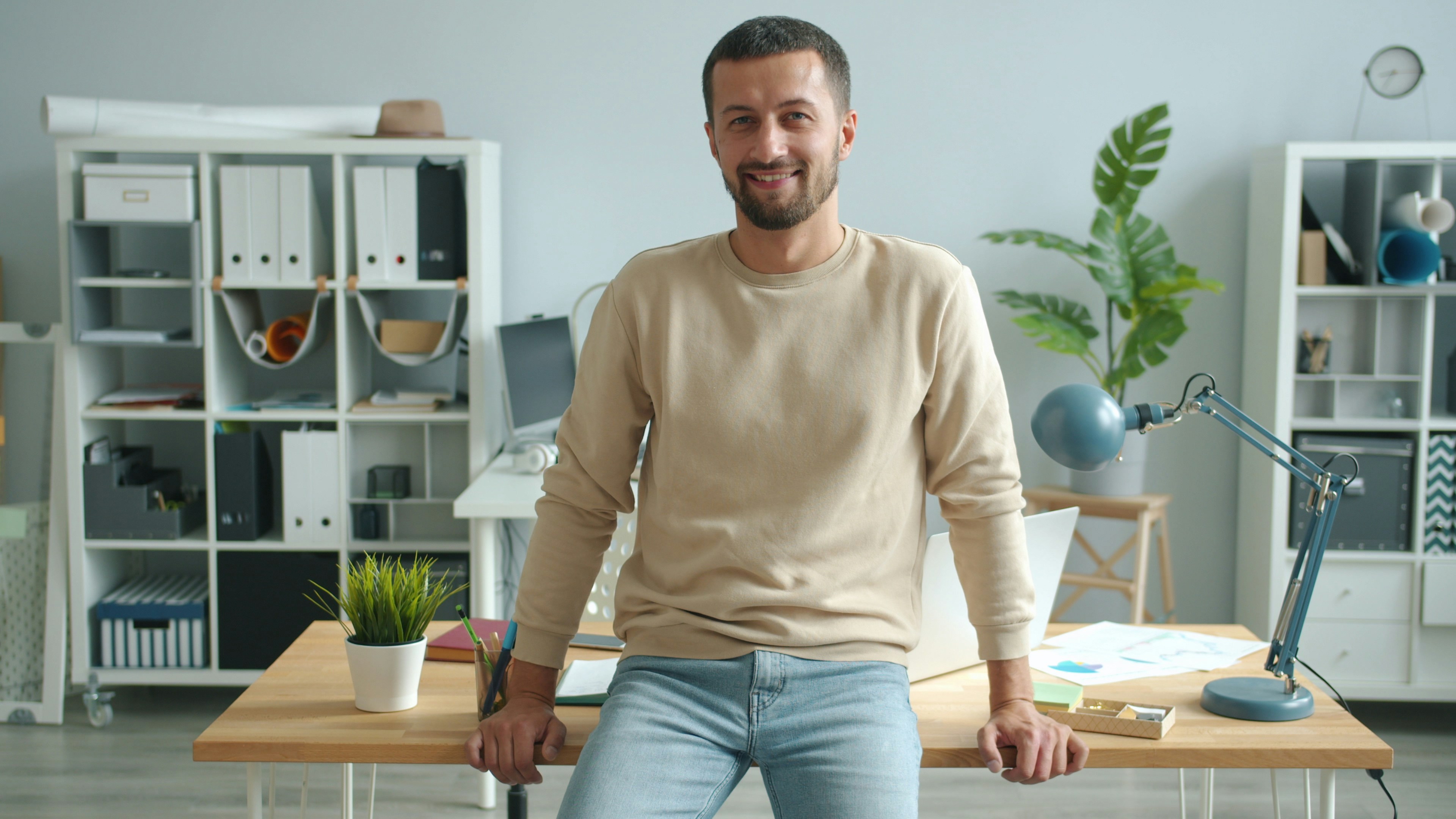 Man smiling in modern office setting