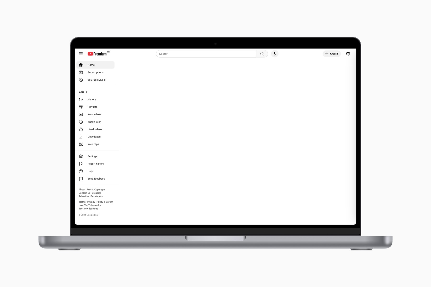 MacBook showing an empty YouTube homepage