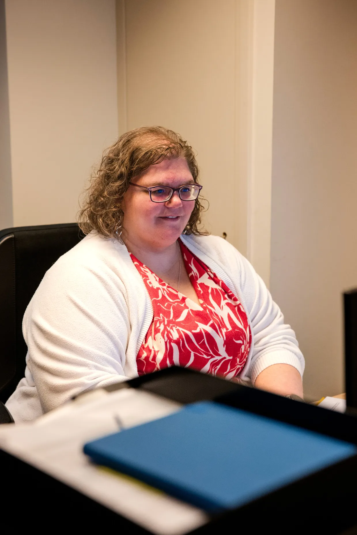 man in green and black plaid long sleeve shirt holding red and black cordless hand drill