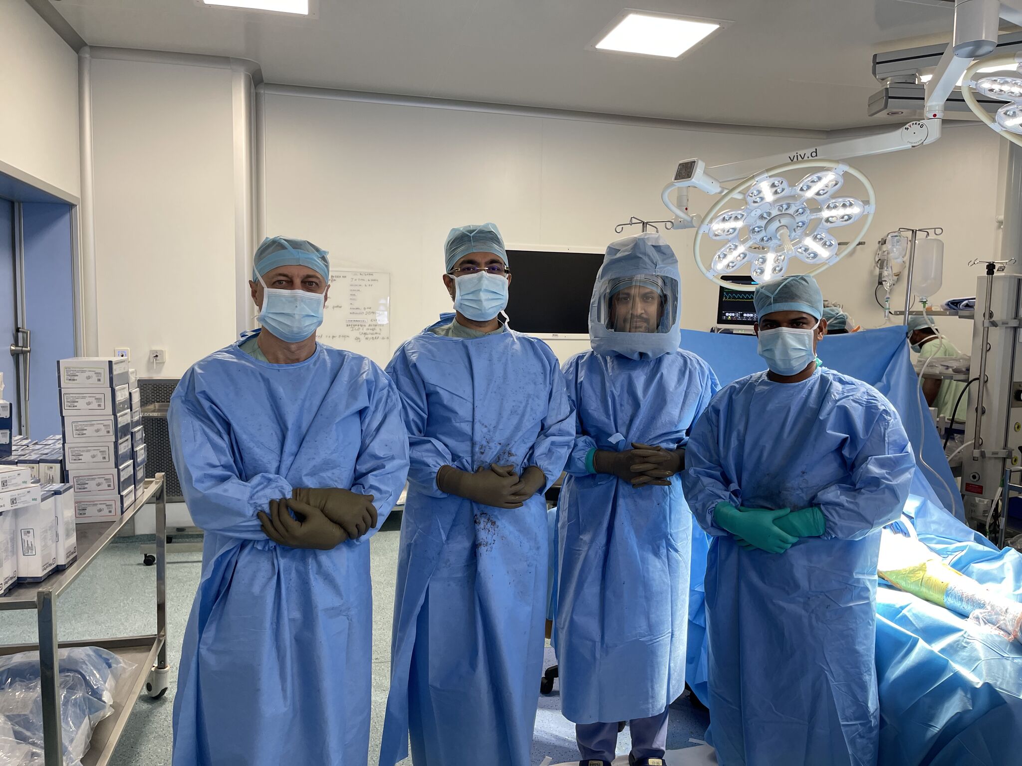 A large gold futuristic tank on a rooftop overlooking a skyscraper city