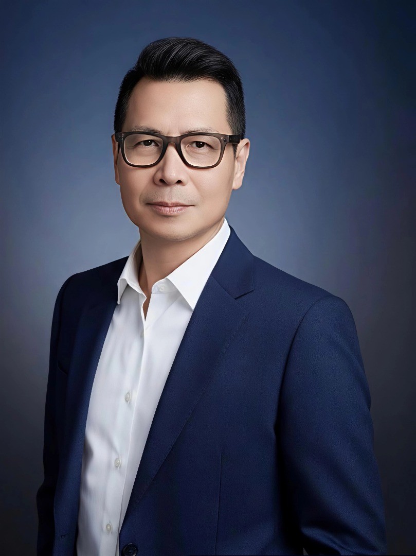 a man in a white shirt looking at the camera