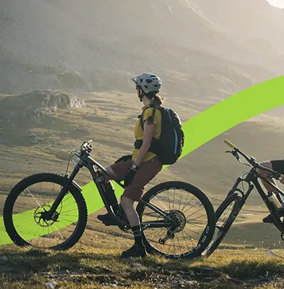 A close-up of a person wearing green-tinted glasses, with a serious expression and smooth skin.