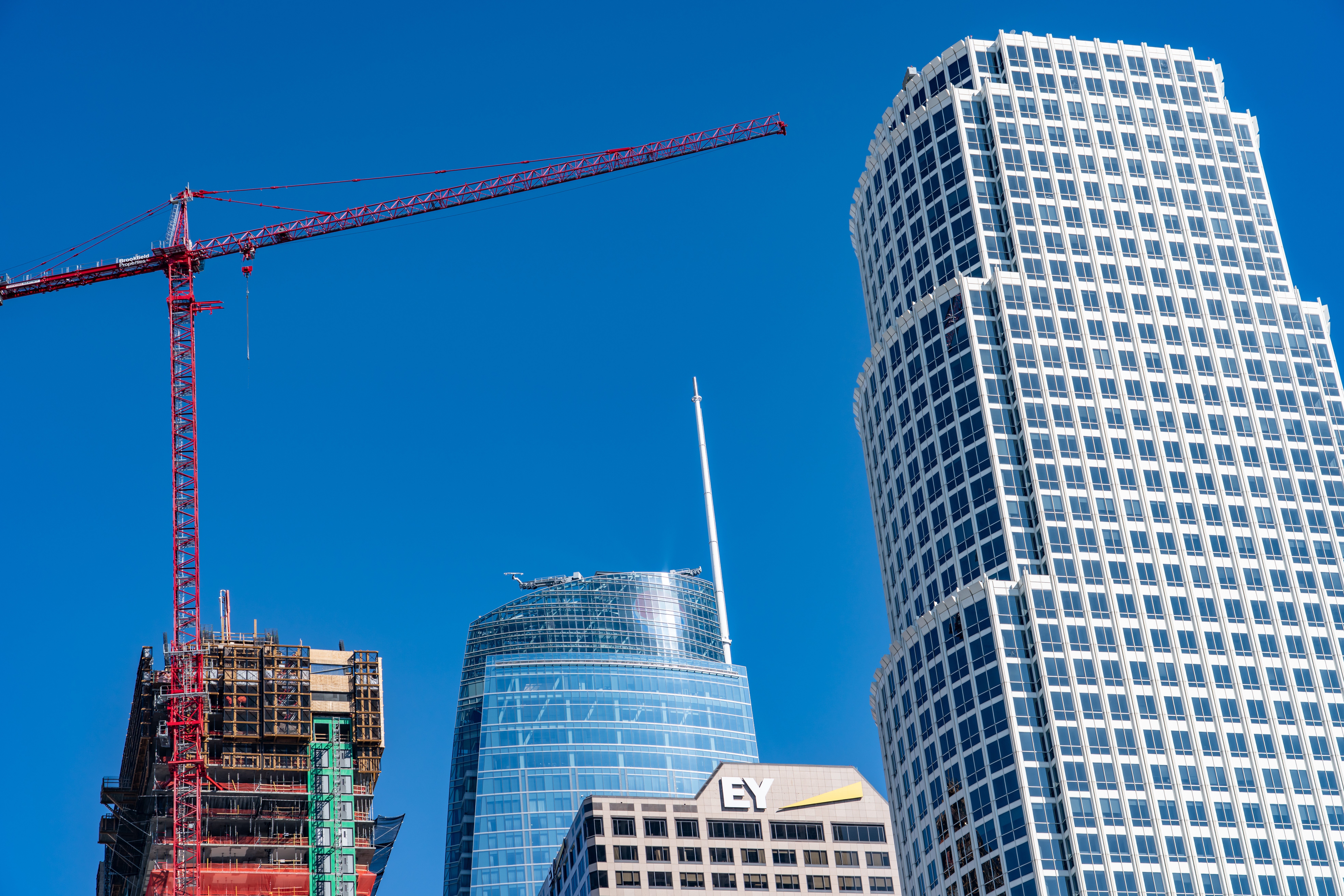 Downtown Los Angeles high-rise construction and cranes illustrating how Los Angeles Measure ULA spending affects development activity.
