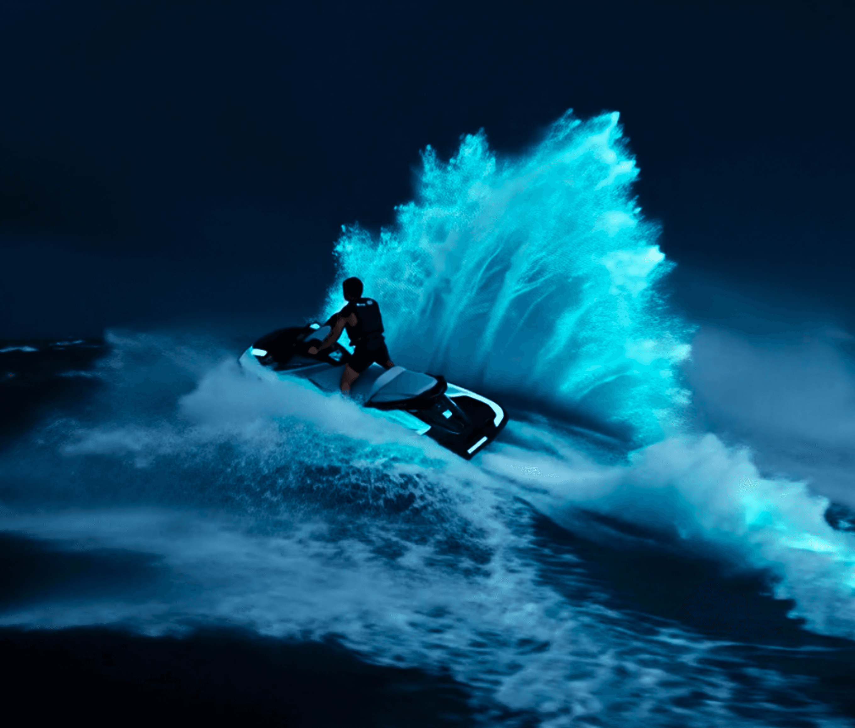 Person riding a jet ski at night with bioluminescent water splashing behind