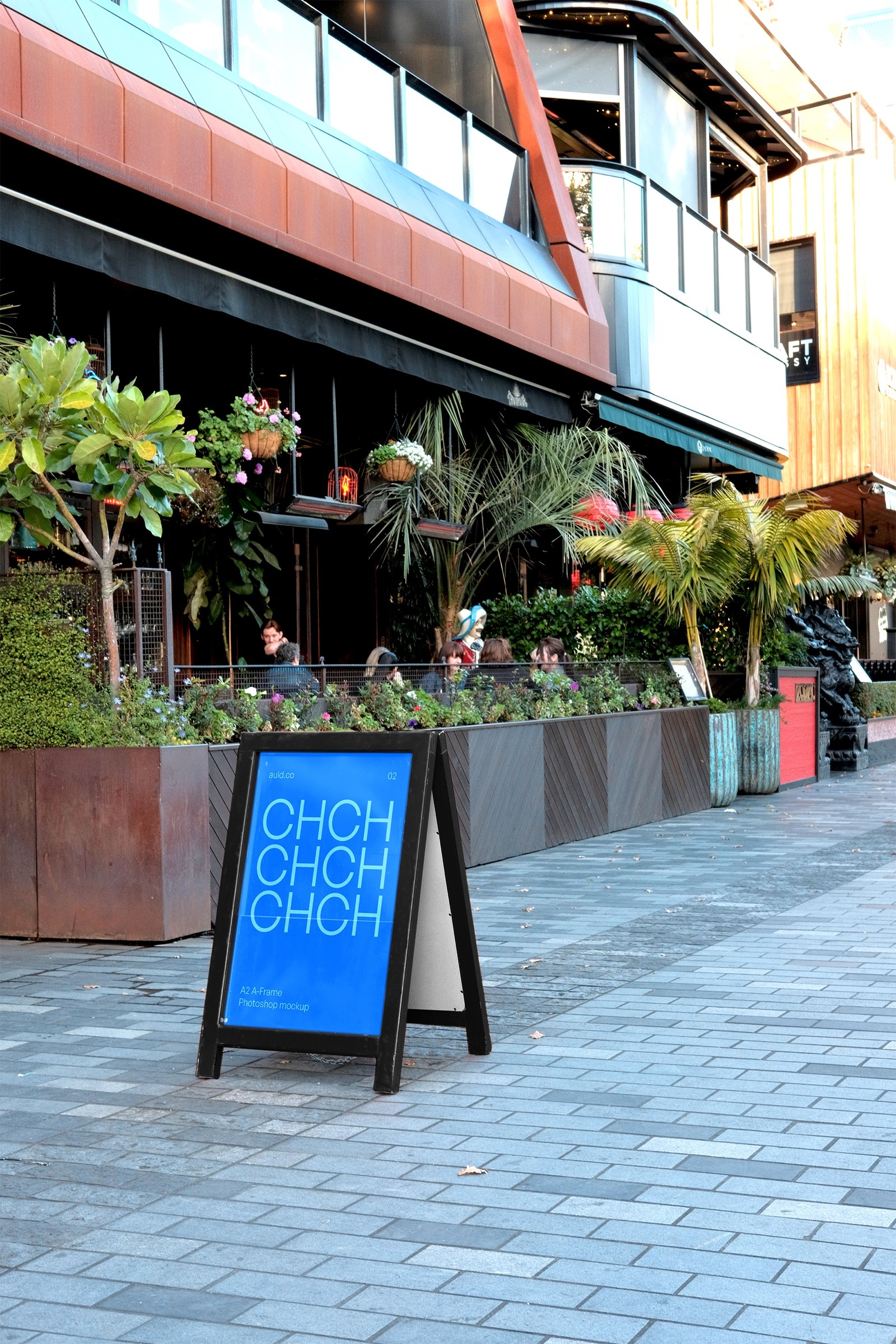 Blue Christchurch mockup artwork on an A-frame outside a restaurant.