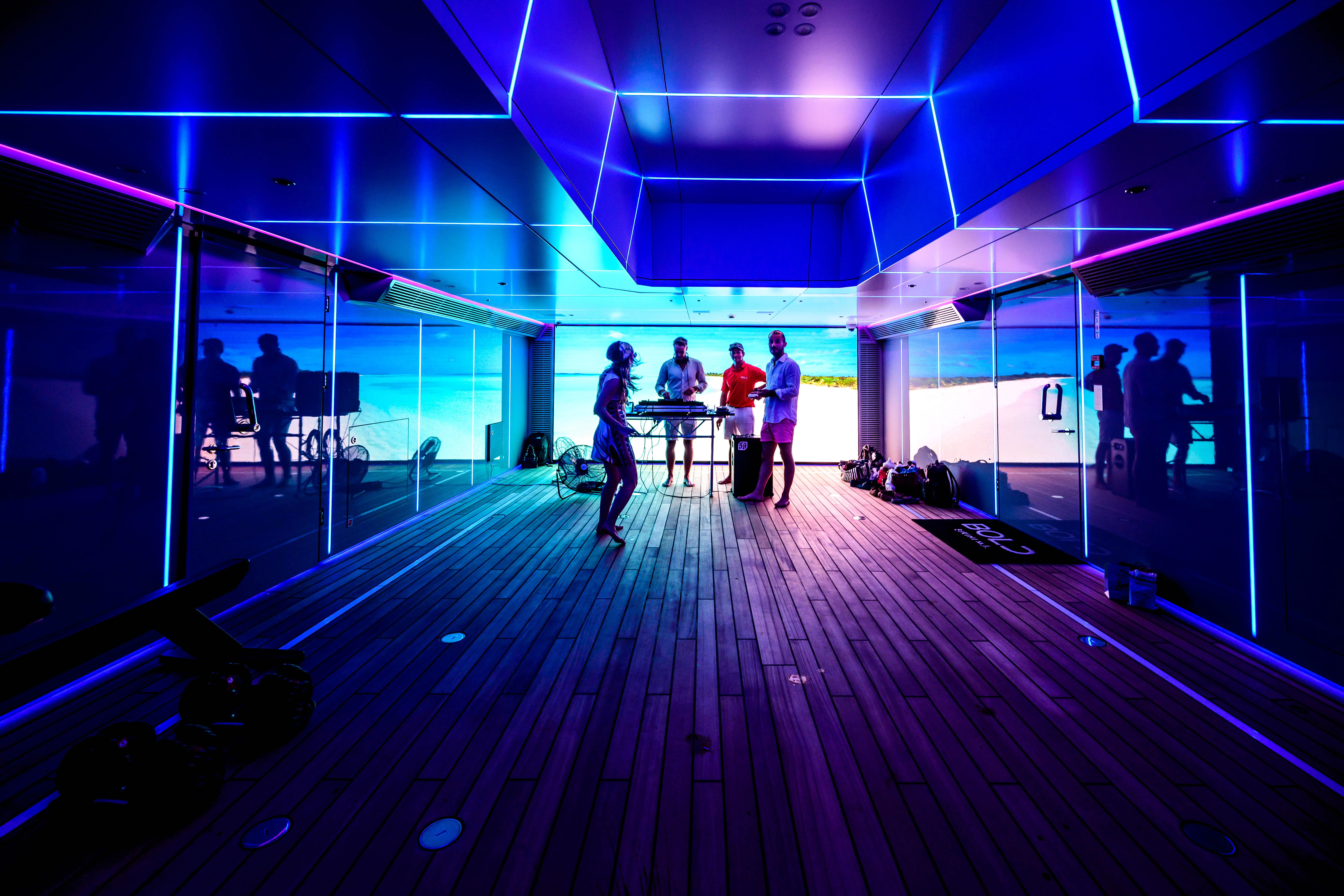 Warm minimalist coffee shop with barista behind counter.