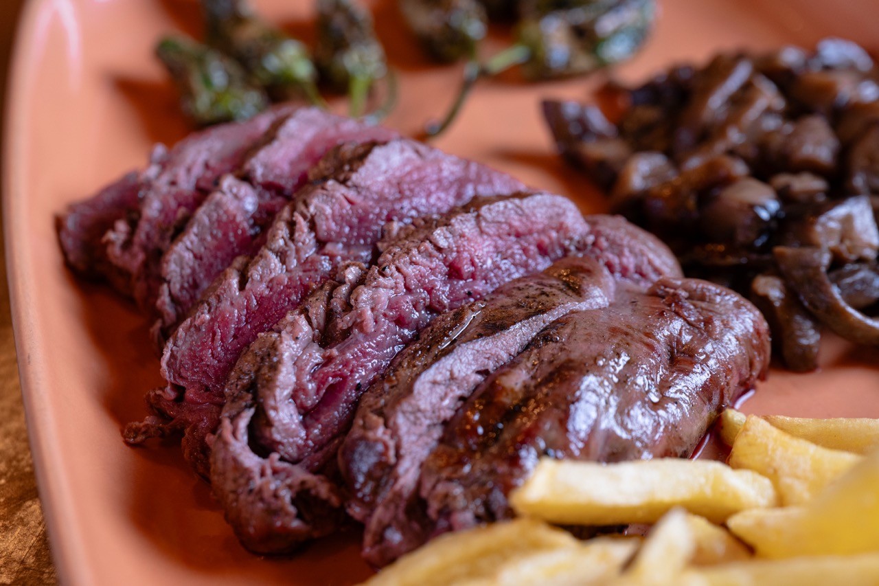 A steak being grilled.