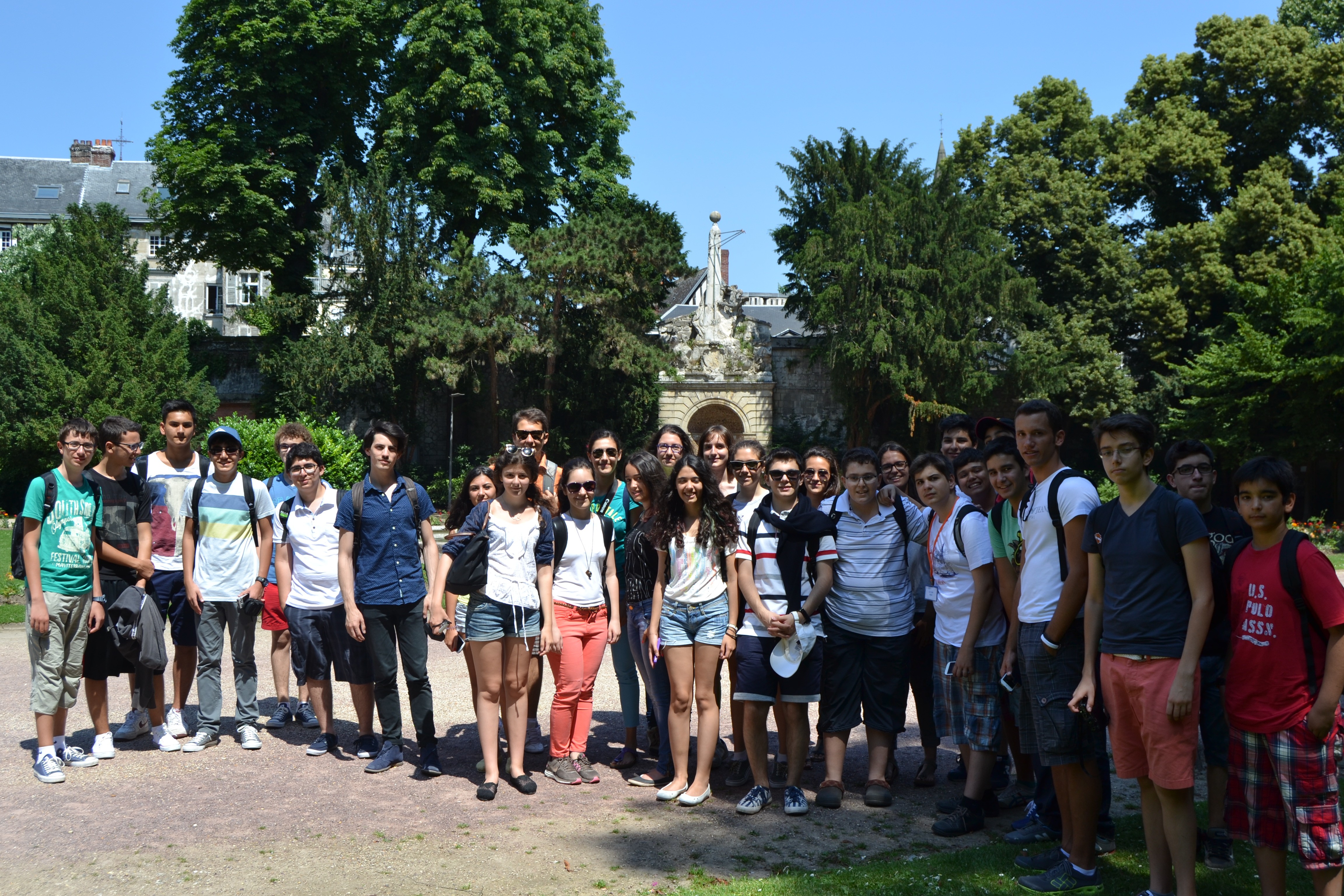 smiling woman in white and black checkered dress shirt