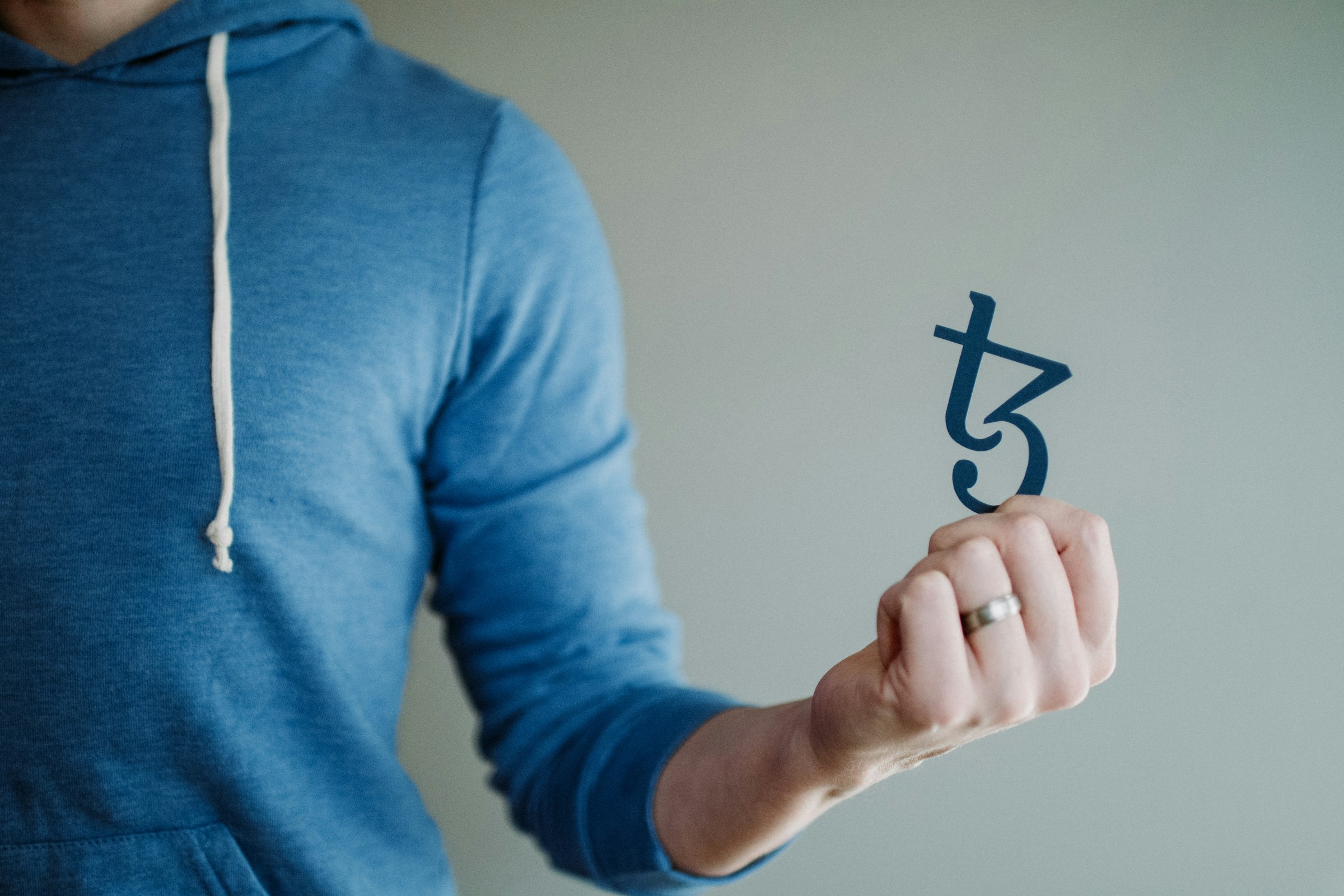 man holding a crypto sign - Crypto Analysis Tools