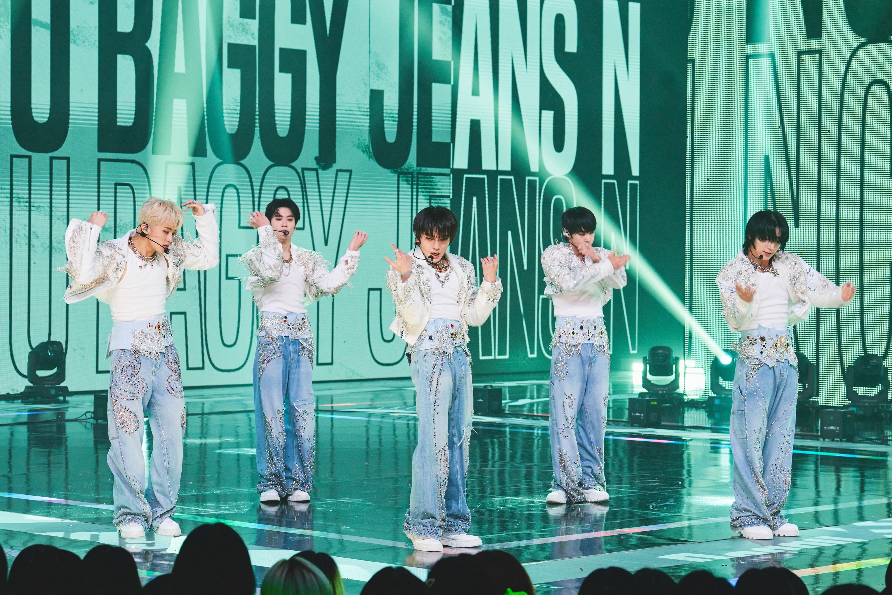 Streetside billboard with flyposters of the Batch.Works brand and illustrations