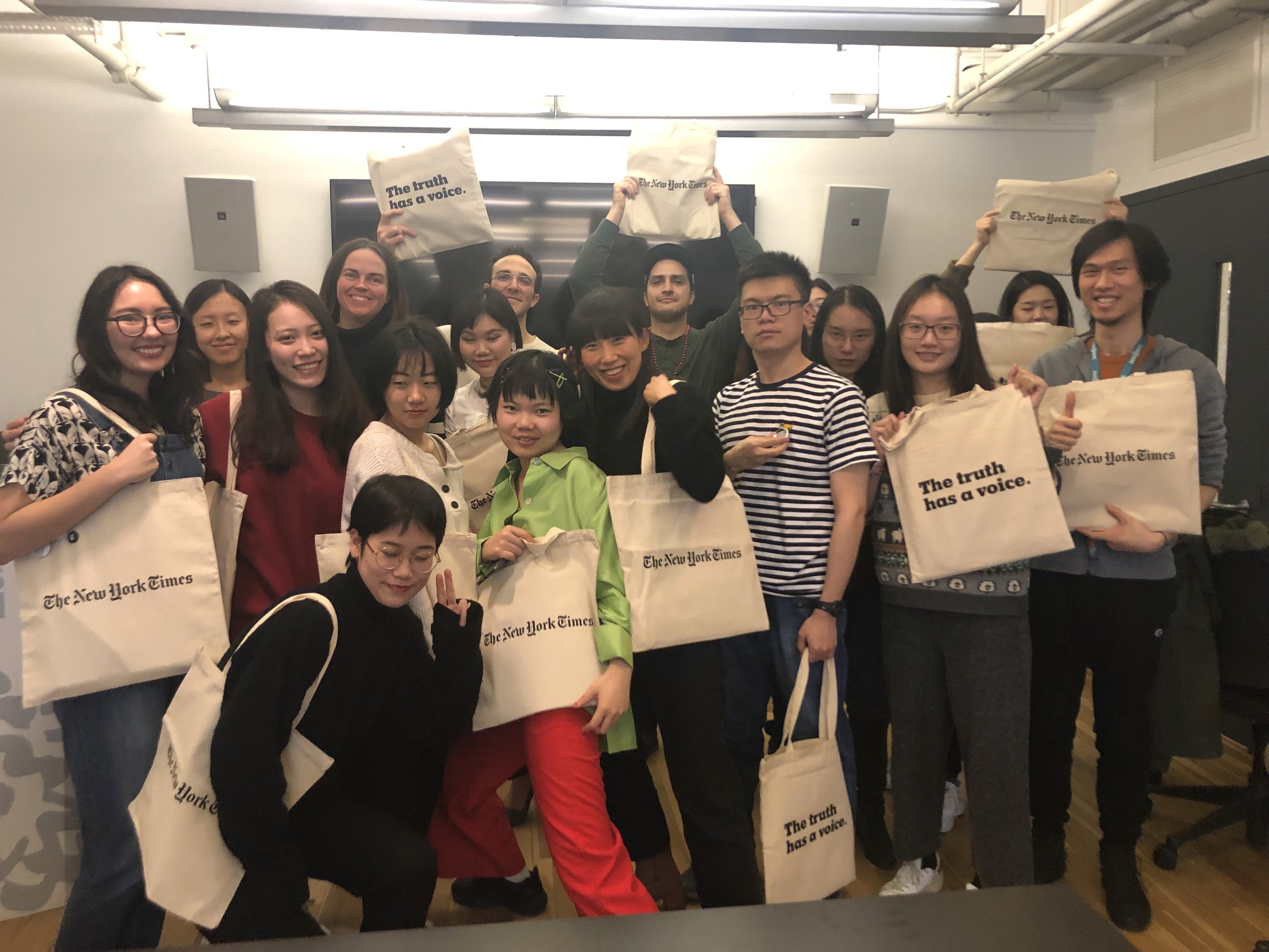 group photo with students holding eco bags