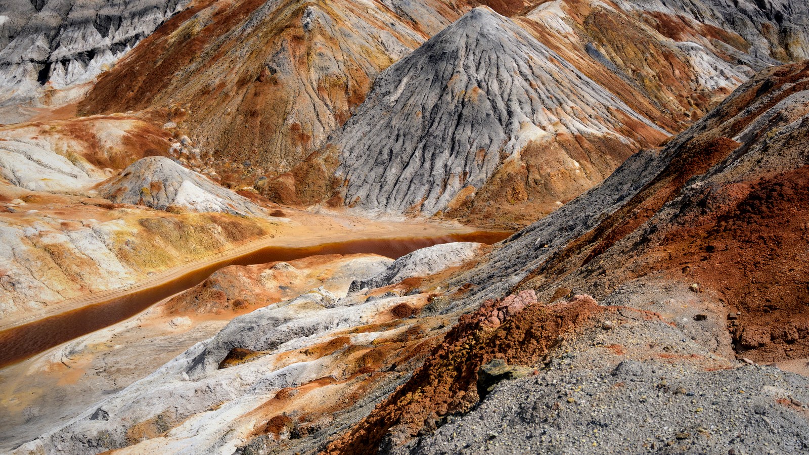 Rugged rare earth geology used as Lost Basin discovery news thumbnail.